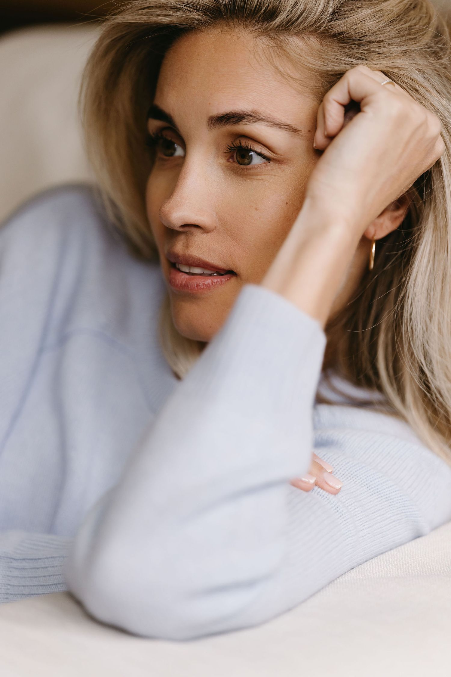 Close-up portrait series showing gentle expressions in soft lighting.