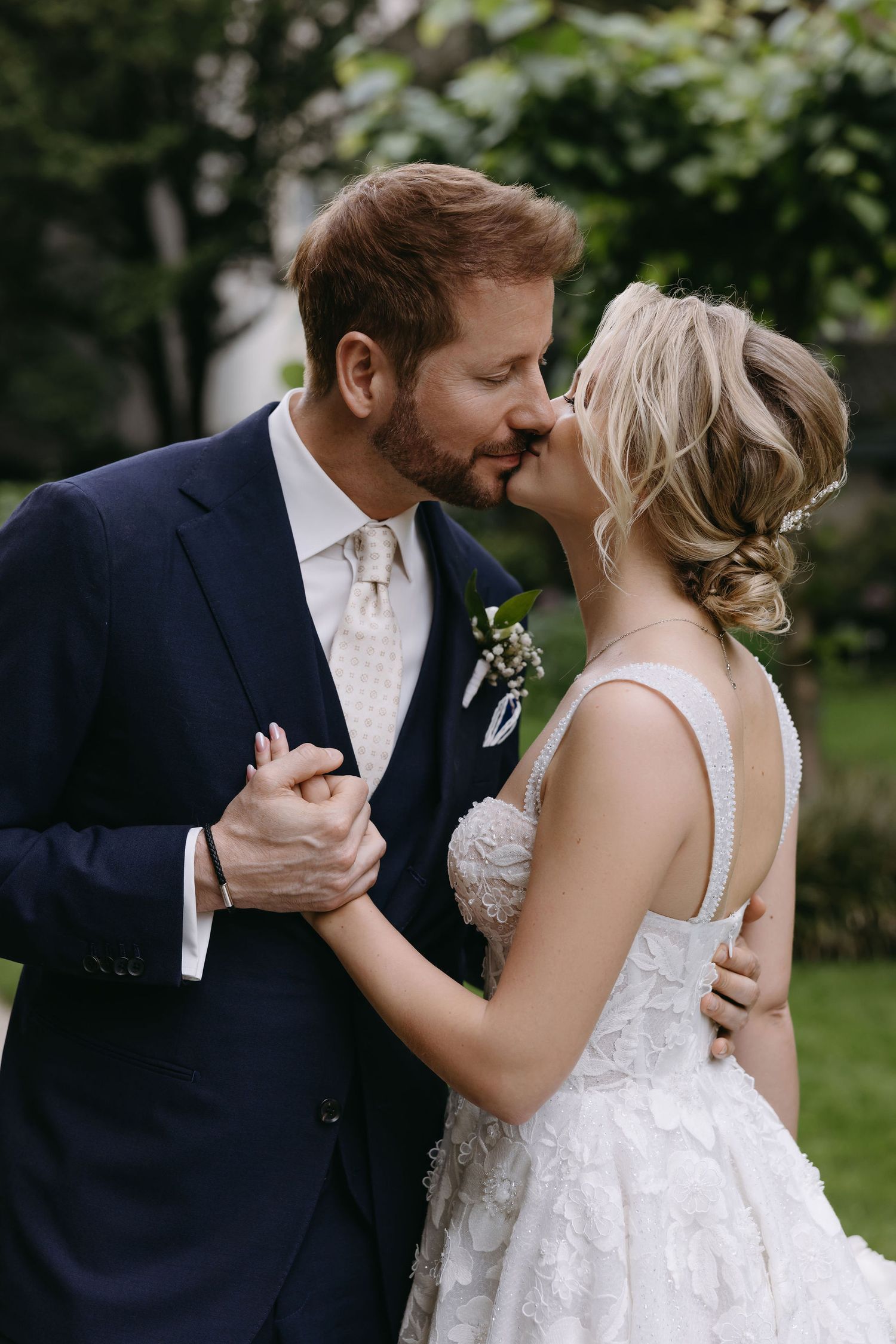 Romantic outdoor wedding portrait session in a garden setting.