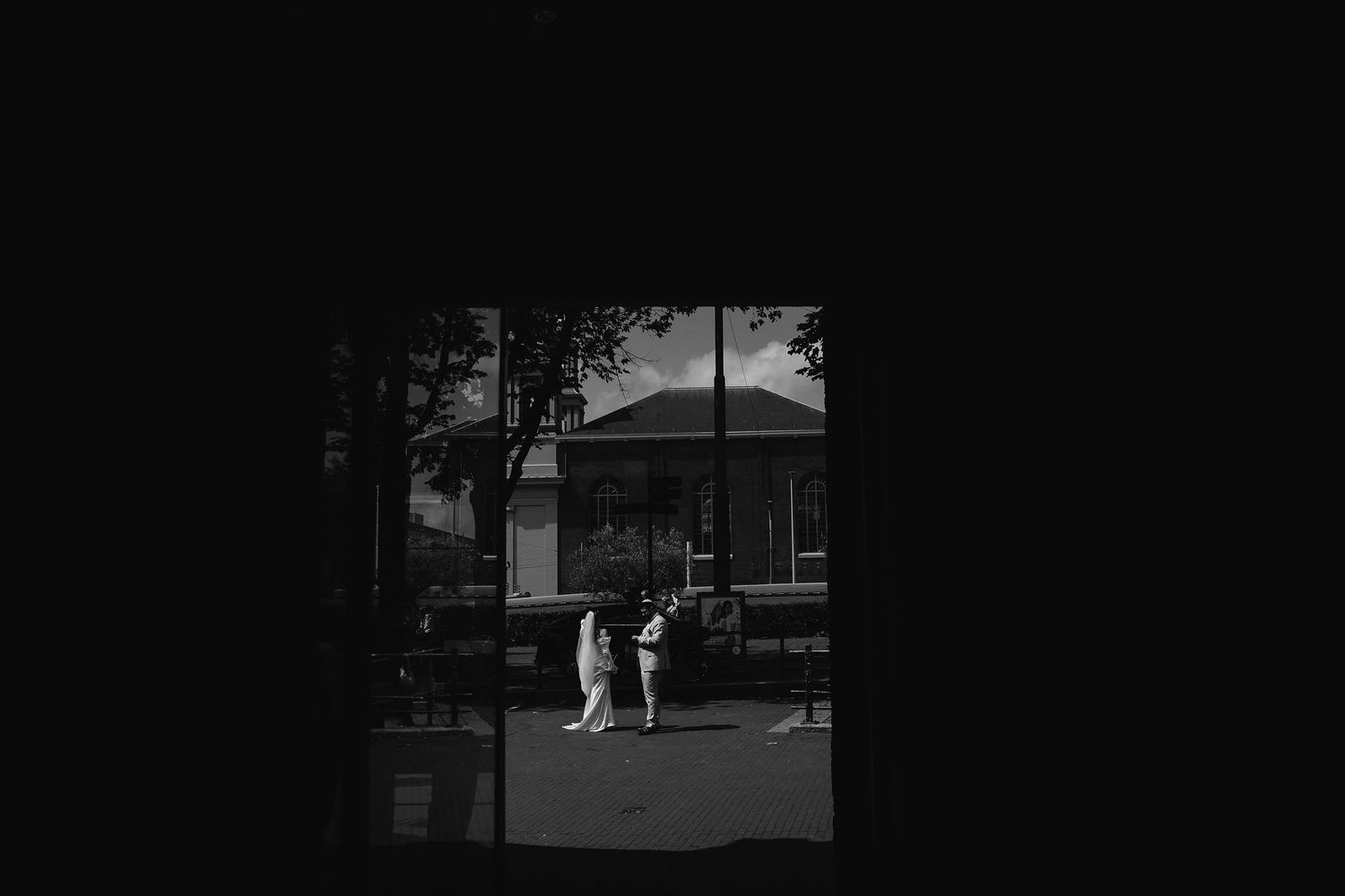 Black and white outdoor wedding scenes in silhouette.