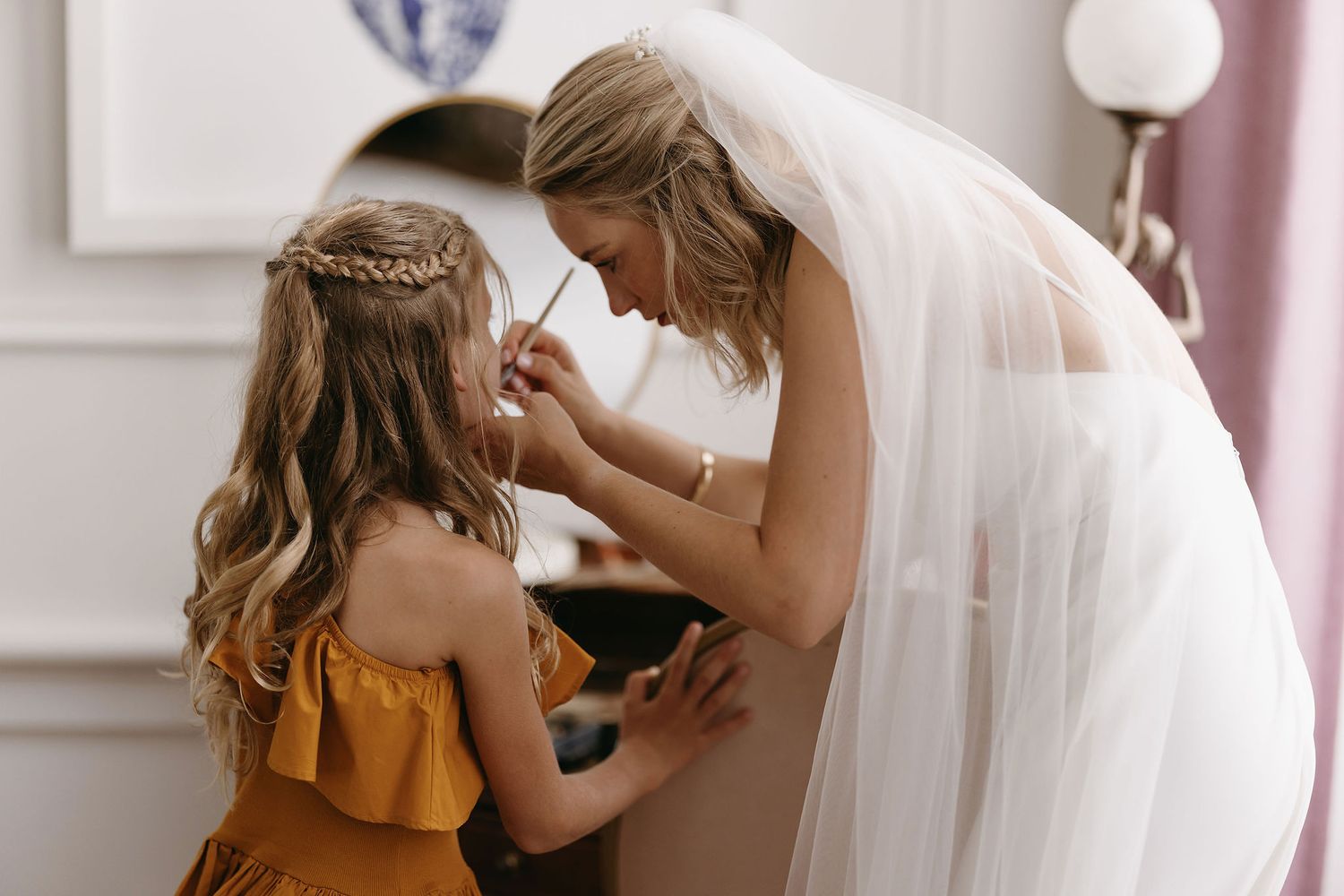 Two people share an intimate moment in formal attire.