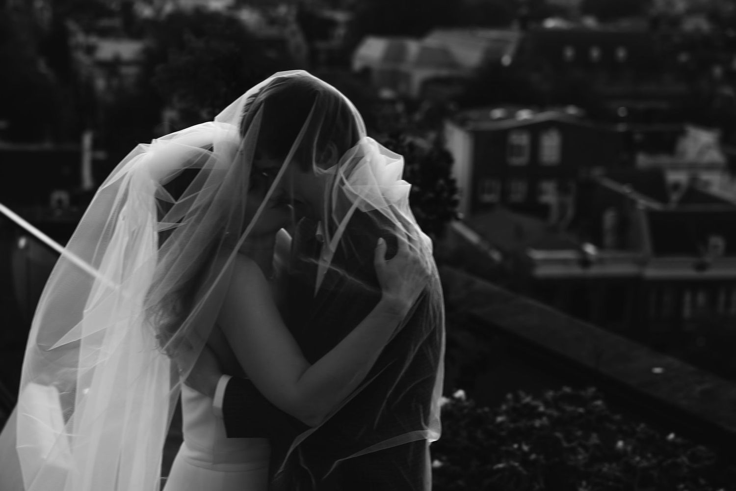 A black and white collage of candid wedding moments captured during an emotional celebration.