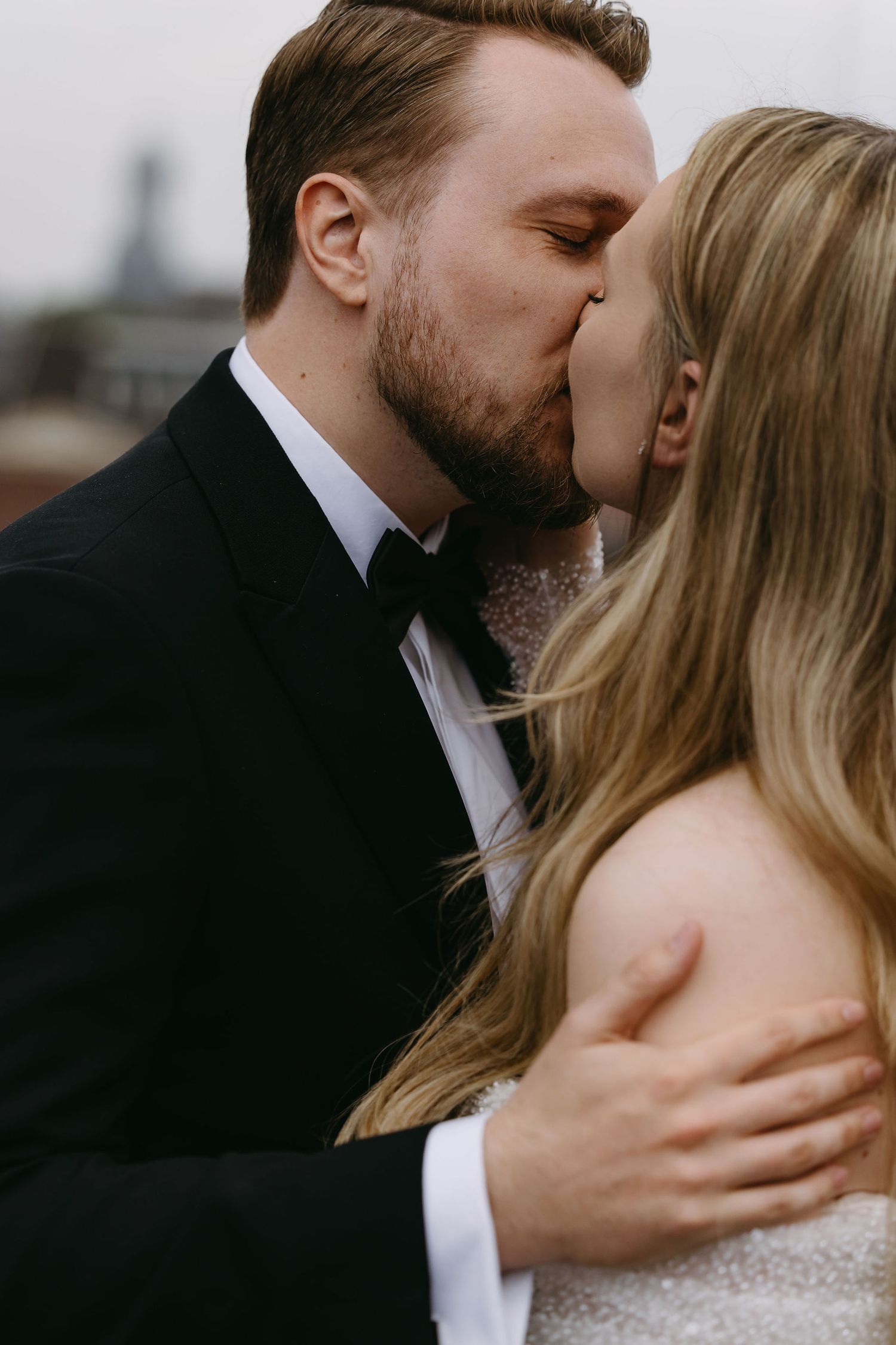 Romantic close-up of newlyweds sharing an intimate kiss.
