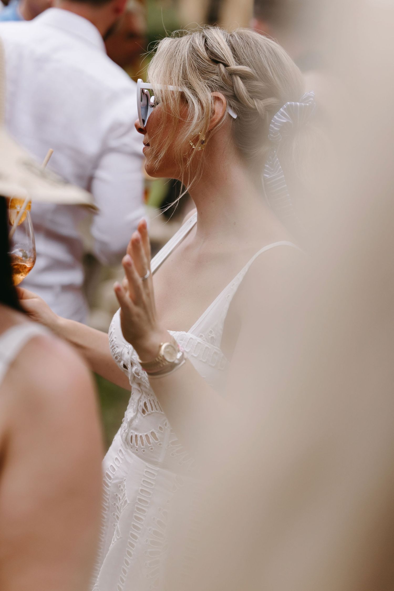 Close-up detail shot of elegant wedding attire in soft focus.