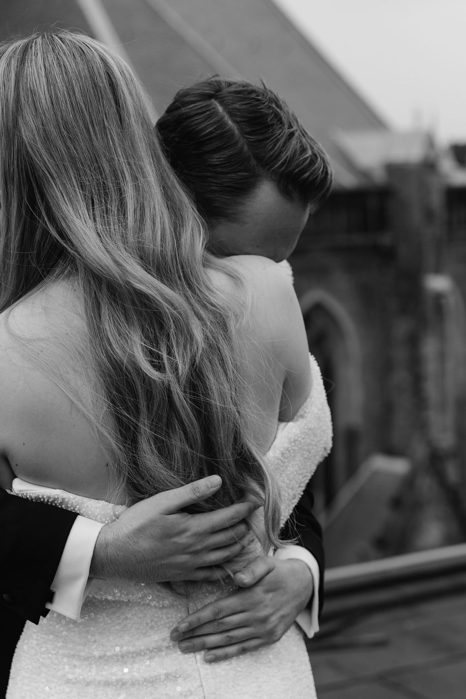 Elegant black and white wedding photography captures intimate dance moments.