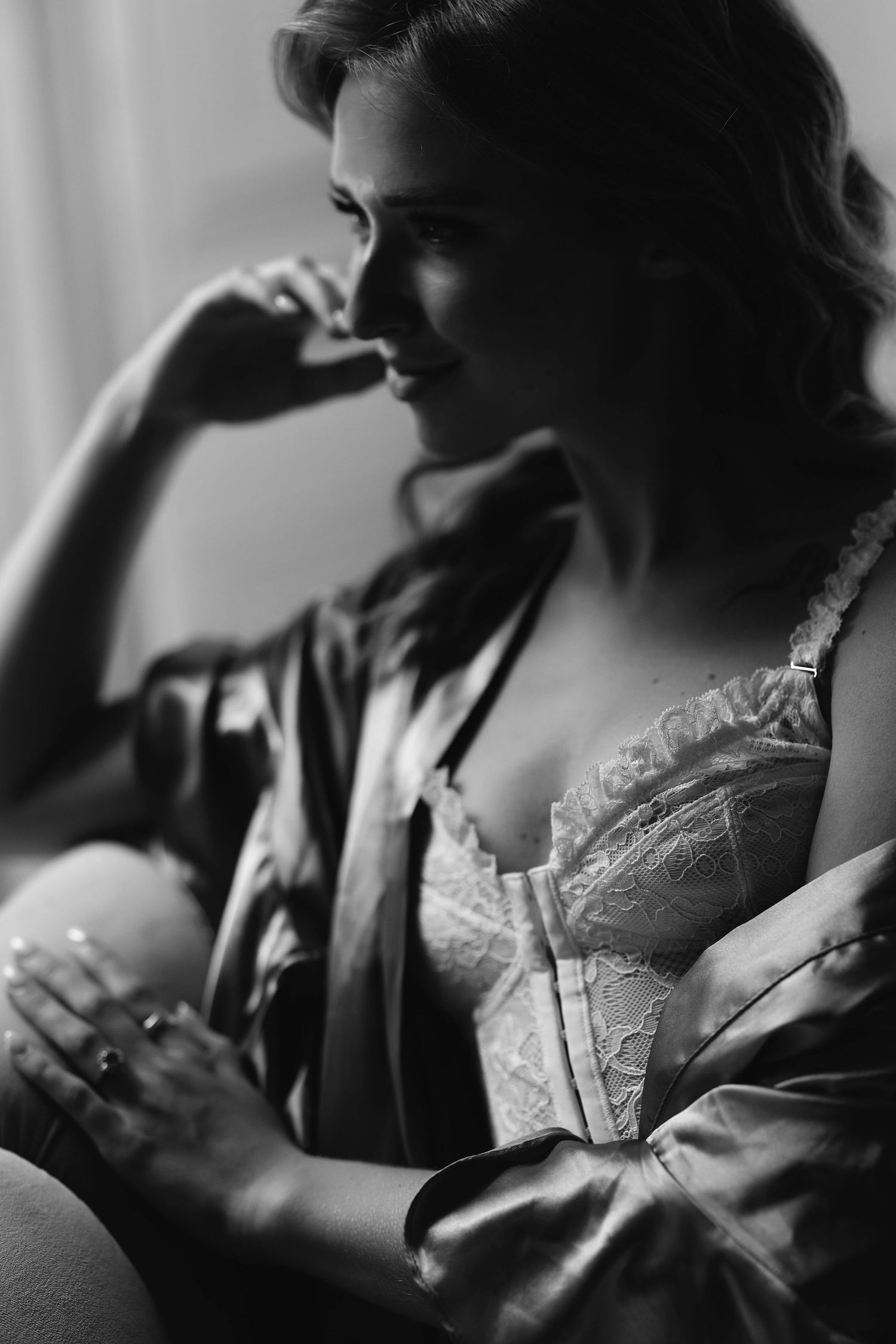 Artistic black and white profile portrait series showing intimate moments in soft lighting and vintage lace details.