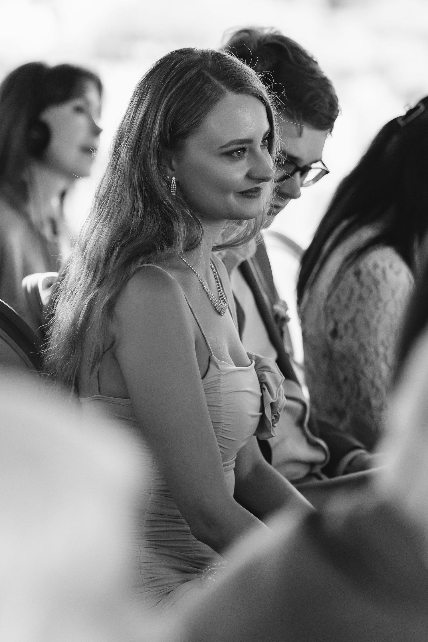 Black and white candid shots of wedding guests during reception.