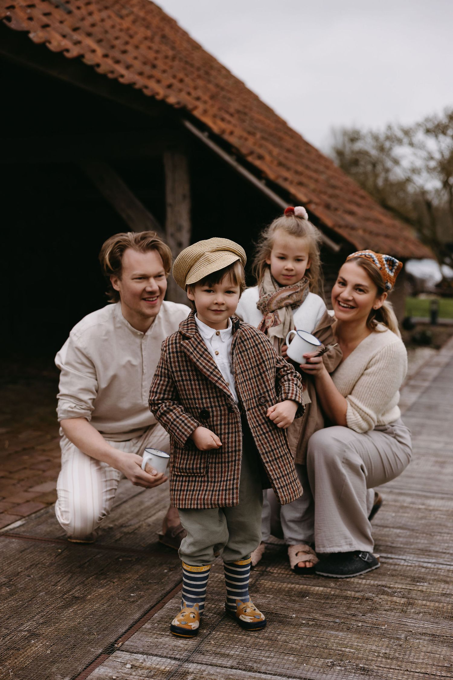A sentimental series of family portraits on a rustic wooden deck captures shared laughter and joyful moments.