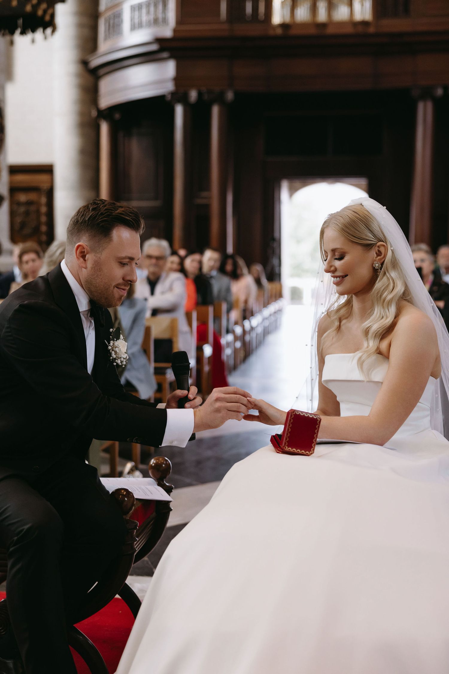 A special moment during a wedding ceremony with a ring presentation.