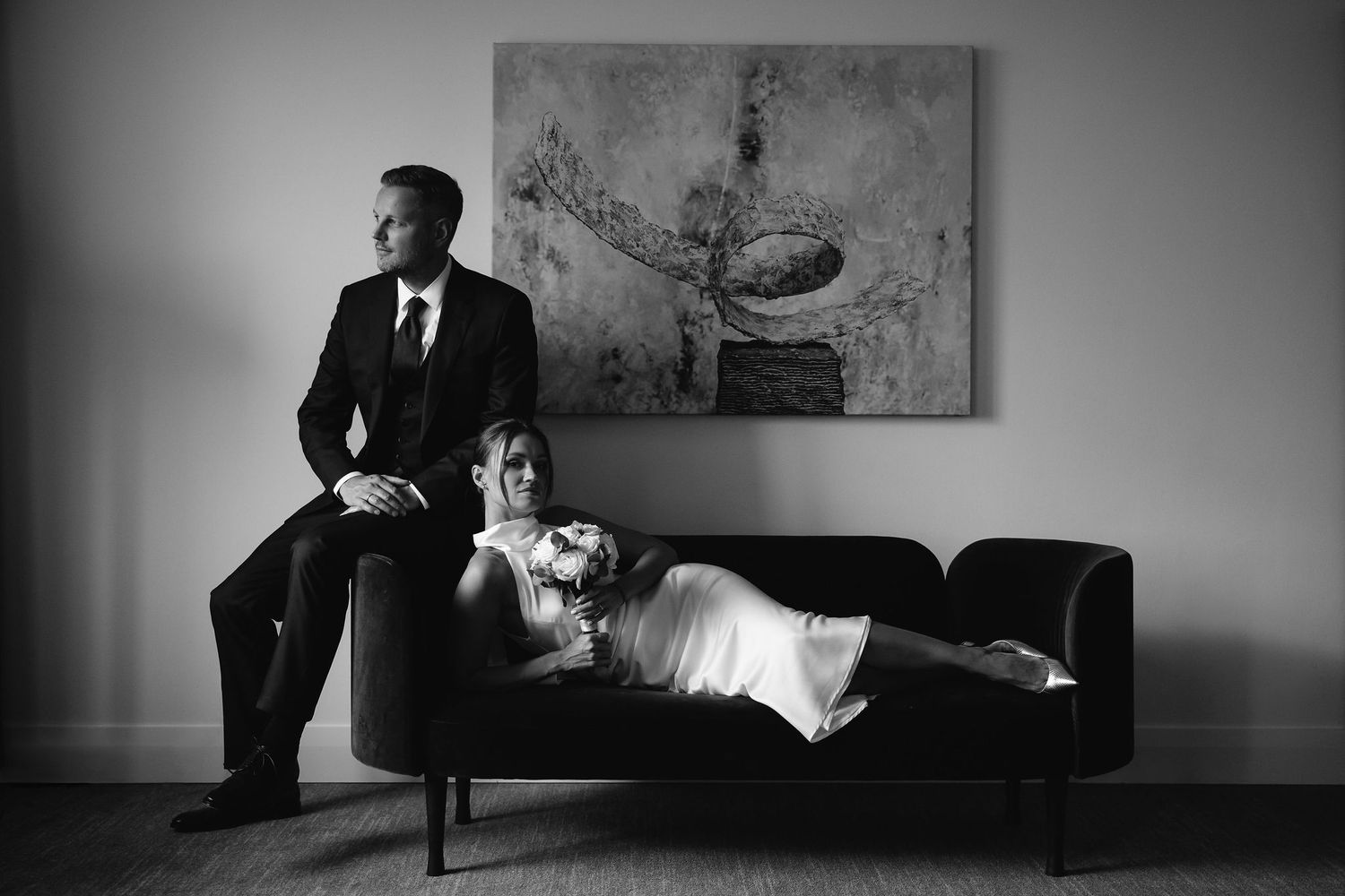 A black and white photo sequence showing the joyful reaction and celebration of newlyweds at their wedding ceremony.