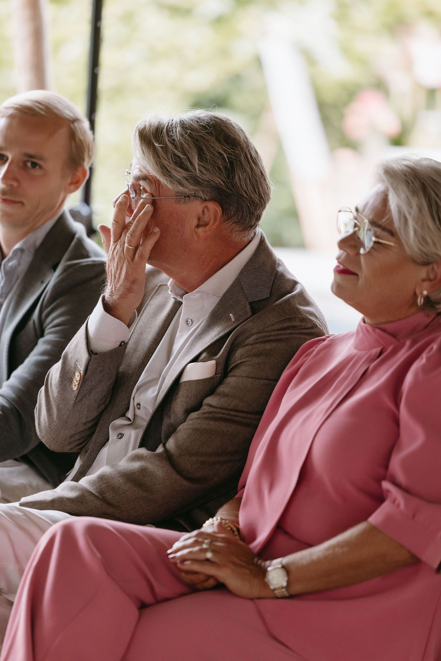 Emotional wedding ceremony scene with guests reacting during the service.
