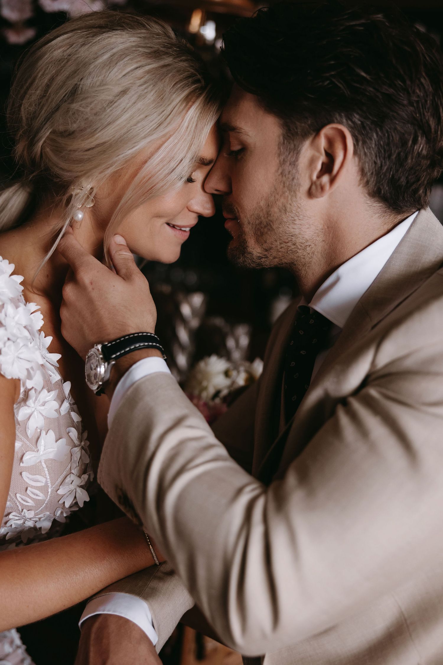Intimate close-up wedding portrait showing tender romantic moment.