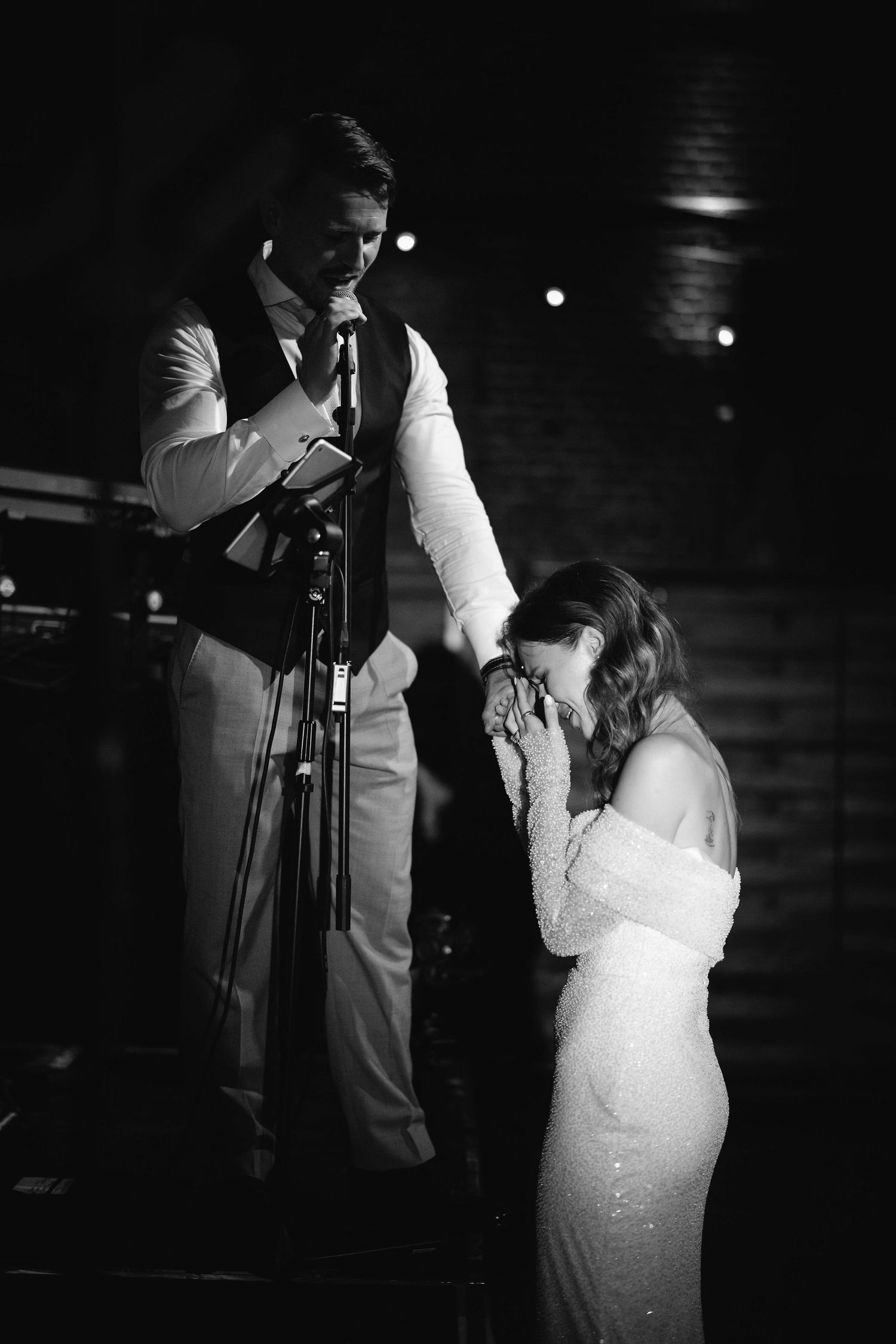 Emotional black and white wedding dance sequence captures tender moments between couple.