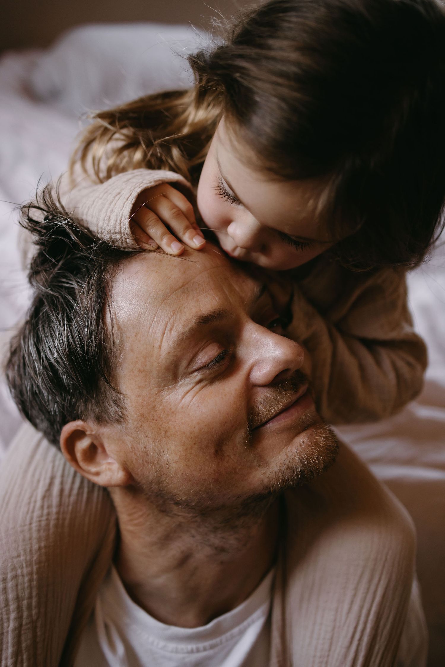 Close up of intimate family moment showing joy and connection.