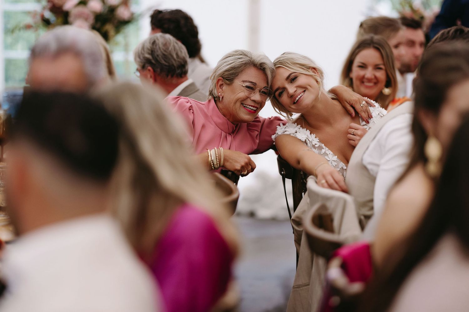 Candid moments of joy and laughter captured during wedding festivities.