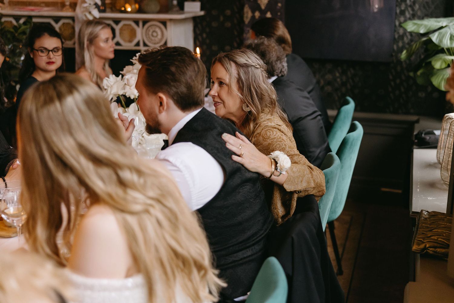 Wedding celebration with guests gathered on a dance floor.