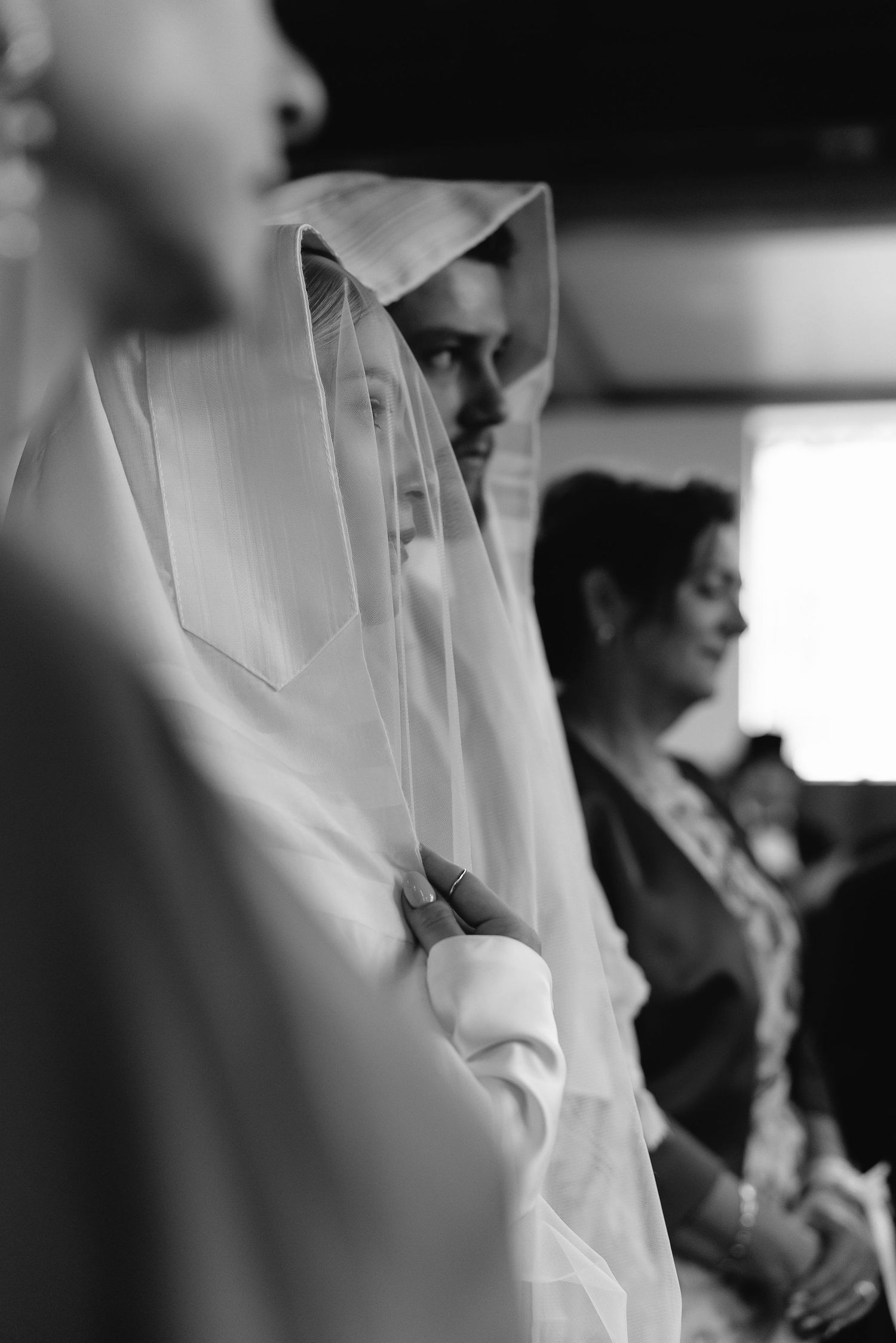 Black and white images showing details of wedding veil and ceremony preparations.