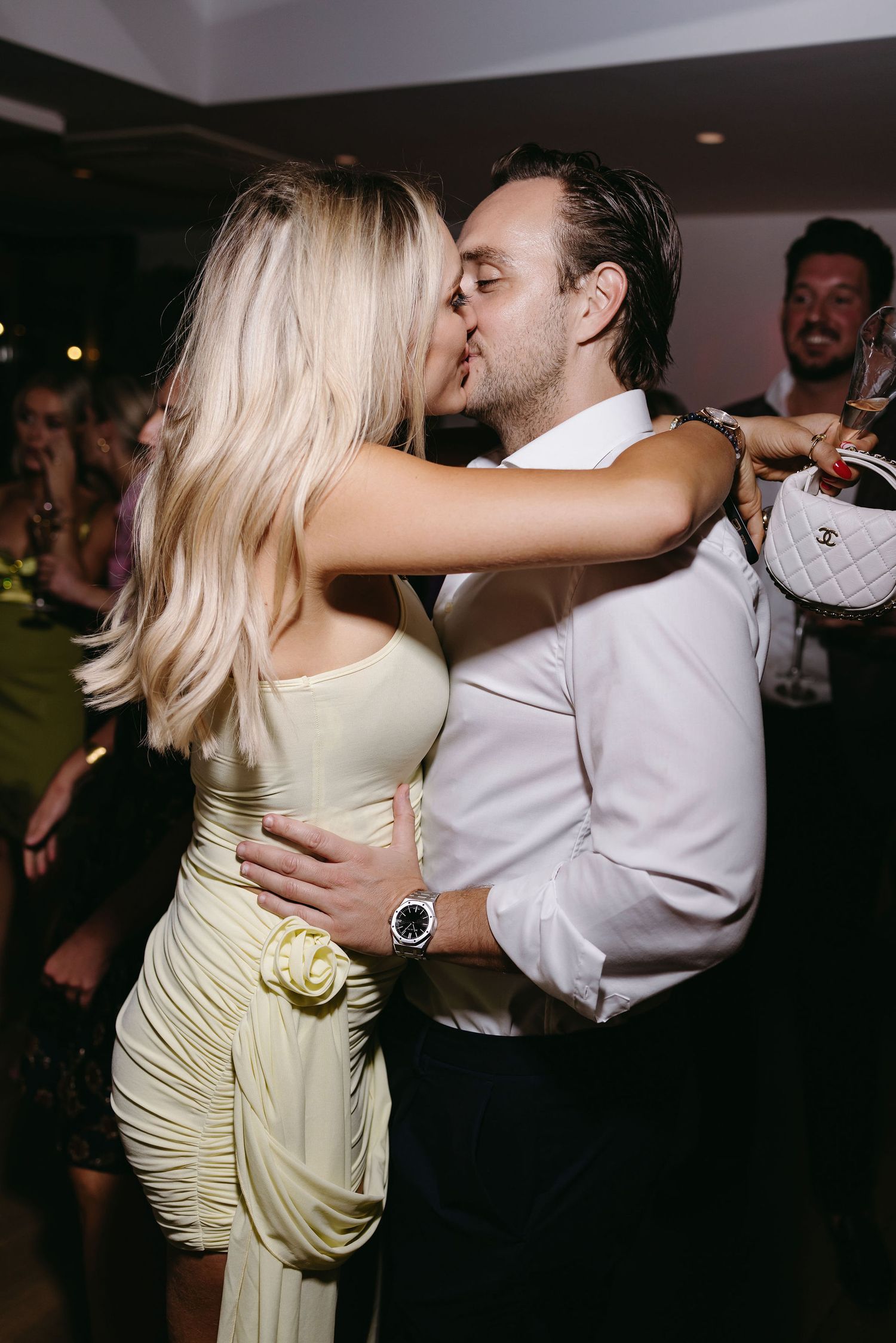 A romantic couple sharing an intimate dance moment at a celebration.