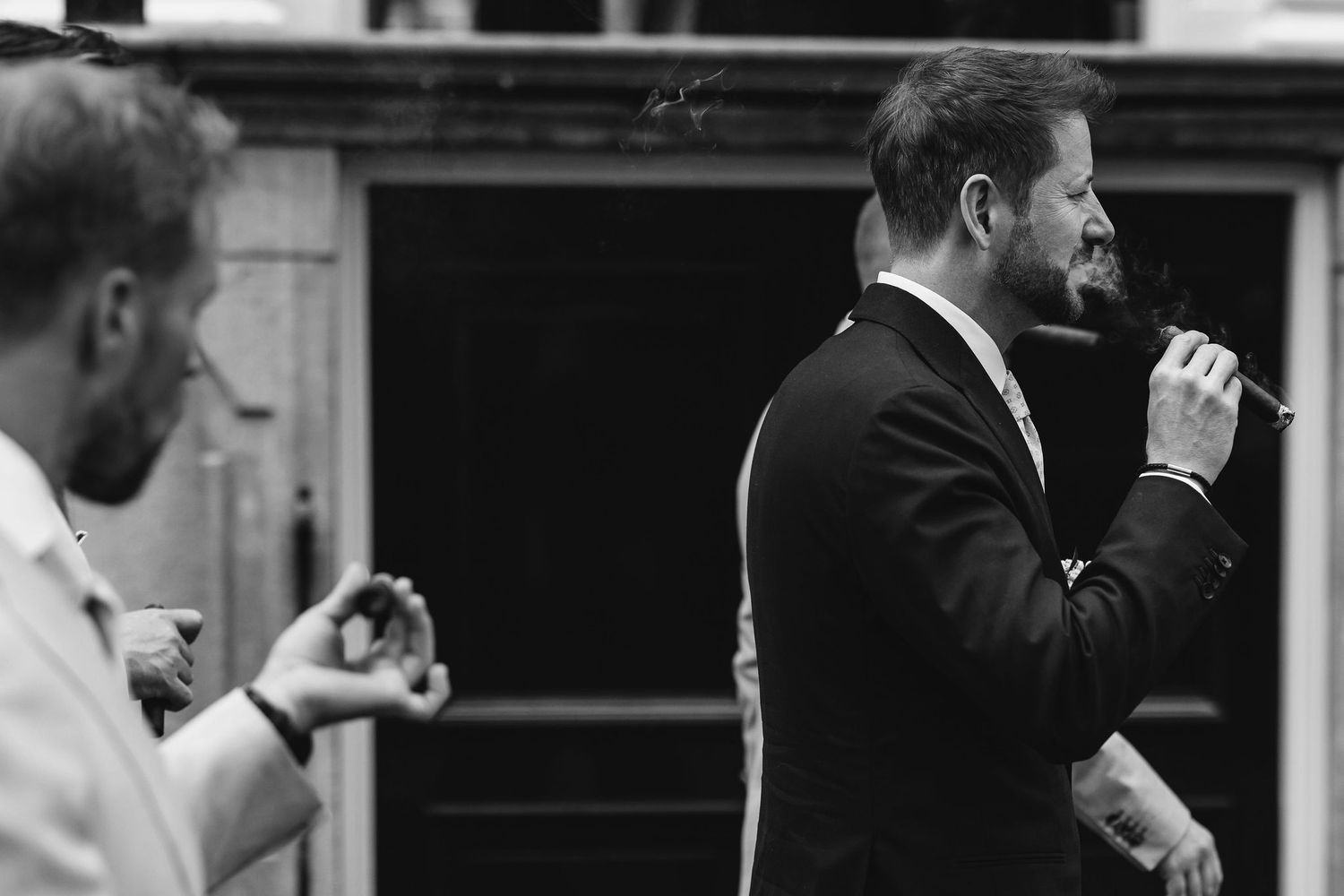Black and white photo strip showing candid emotional wedding day moments at the ceremony and reception.
