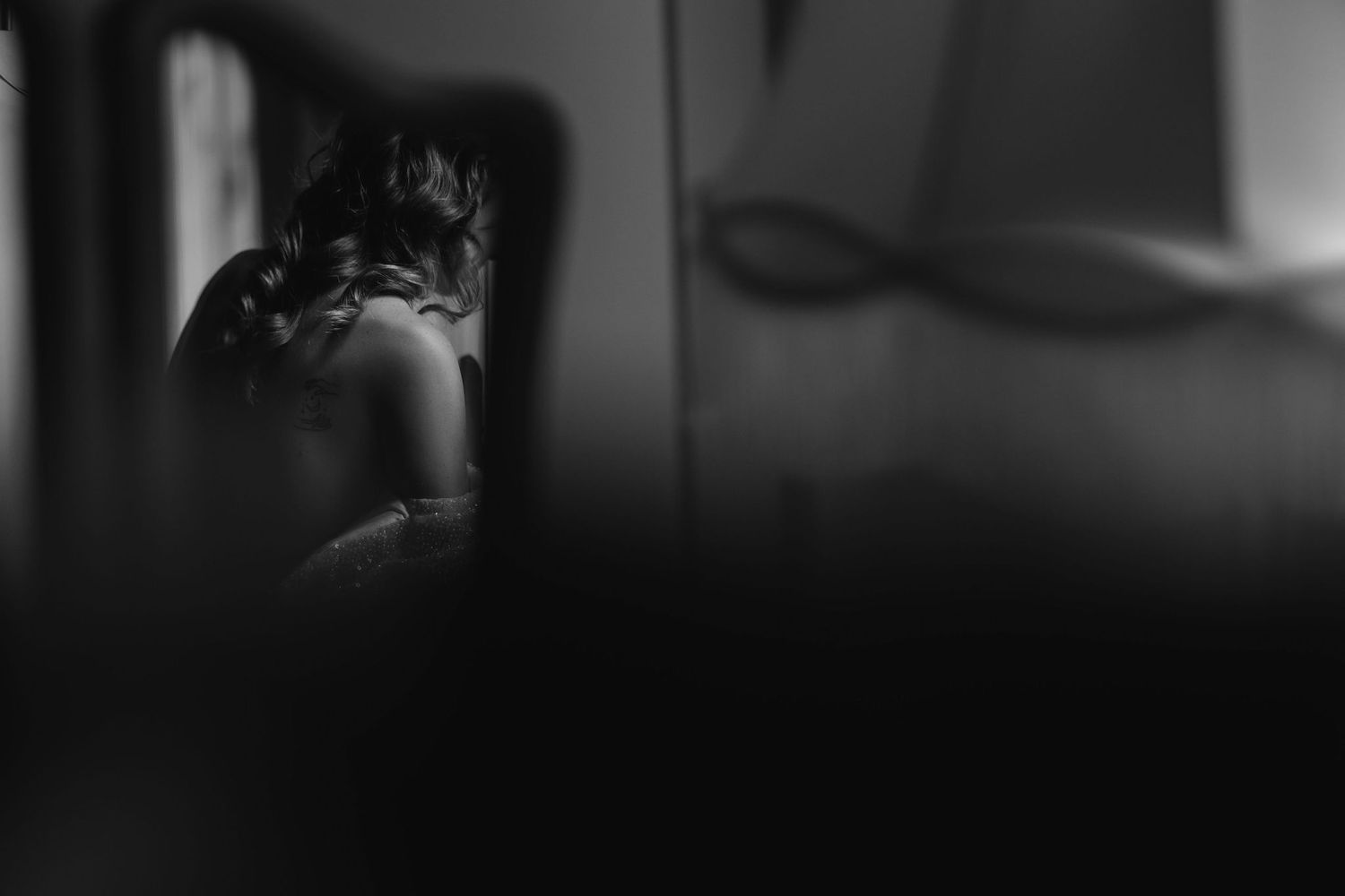 Artistic black and white silhouette photograph with moody shadows.