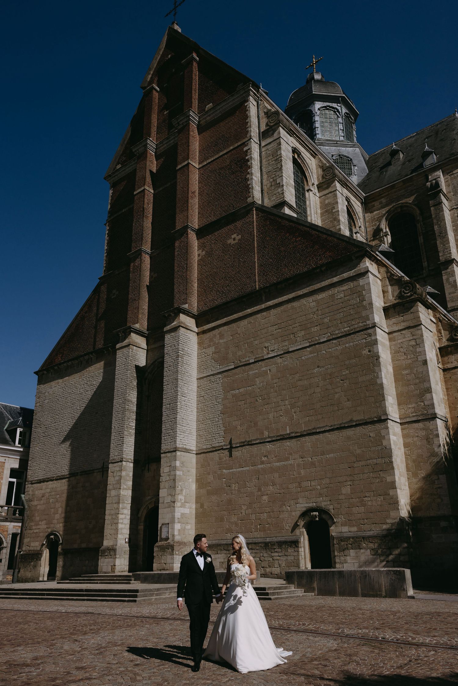 Architectural photograph of a grand historic church exterior with dramatic angles.