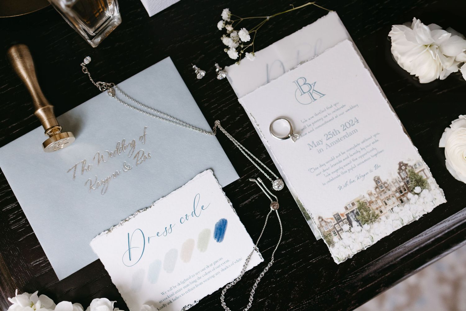 Wedding stationery and invitation suite in blue and white with delicate details.