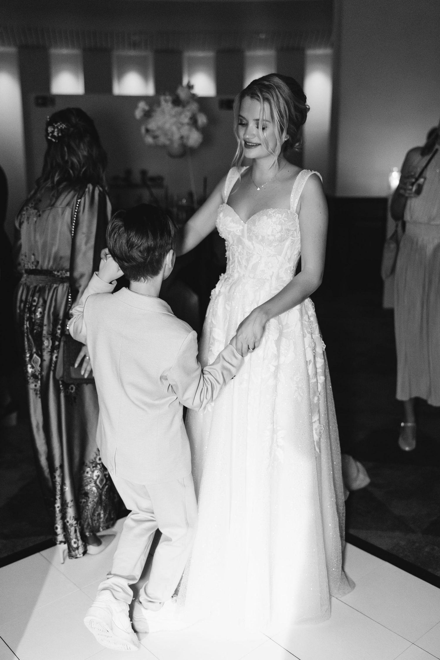 Intimate dance moment between two people in formal attire.