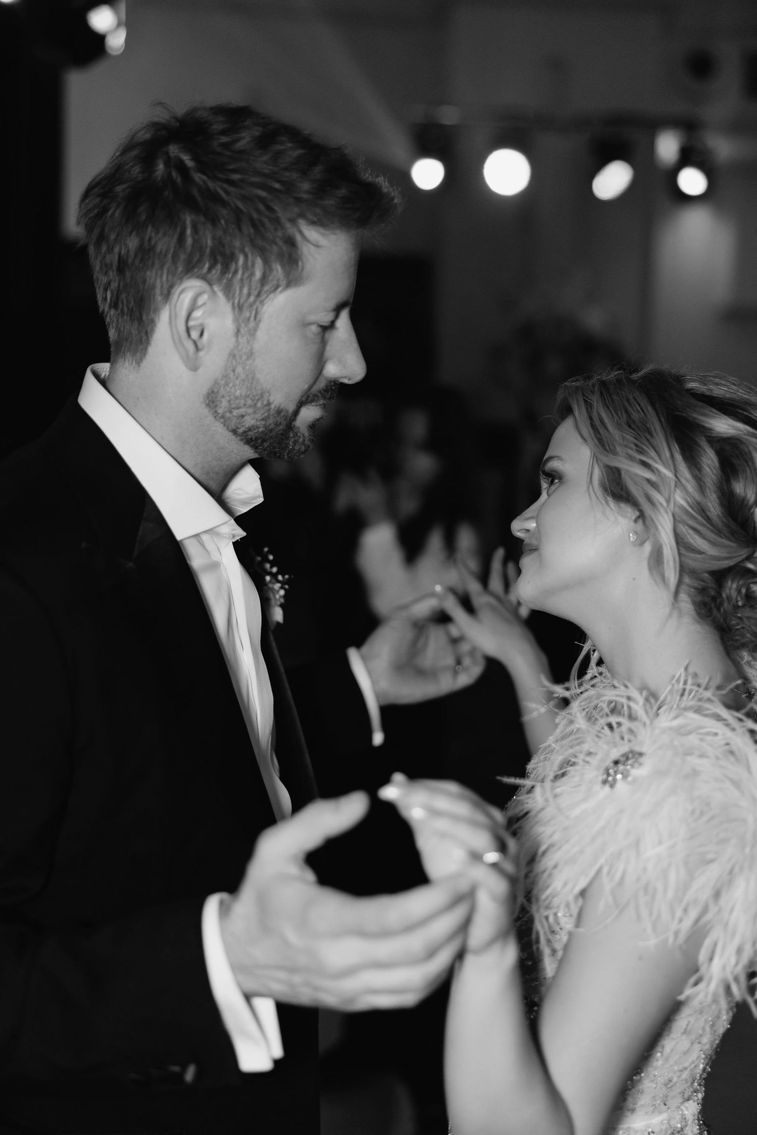 Romantic dance sequence captured in black and white at an elegant wedding reception.