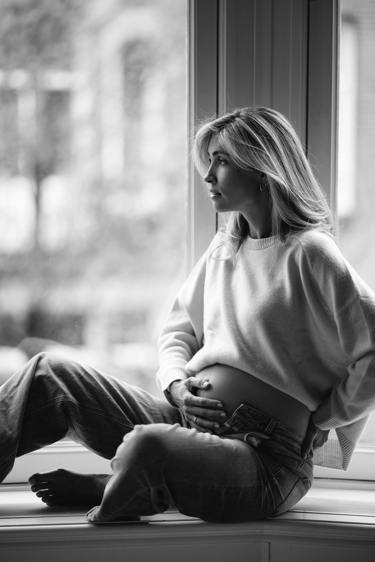 A series of monochrome photos showing a relaxed figure lounging by a windowsill.
