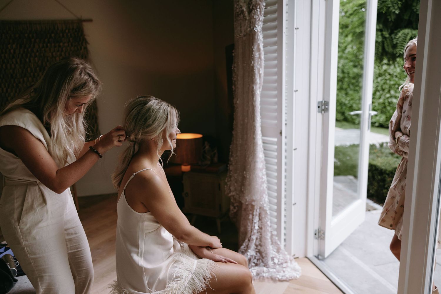 Behind the scenes getting ready moment from a wedding morning preparation.