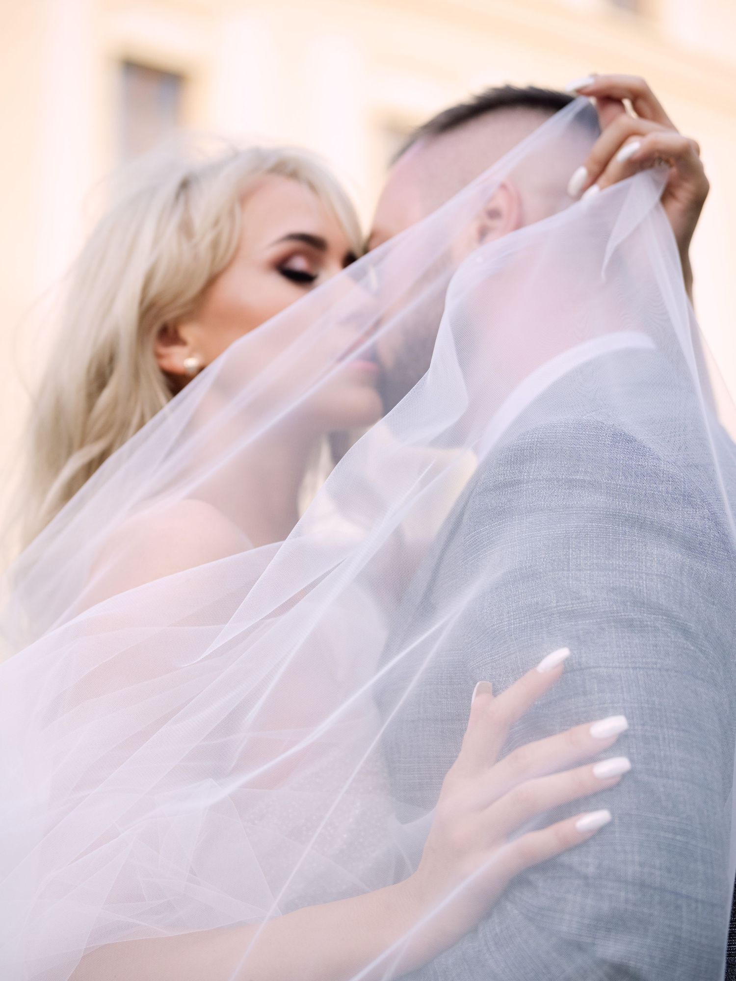 Dynamic couple posing at Prague Castle during a destination elopement, surrounded by historic architecture, captured by Hang Pham
