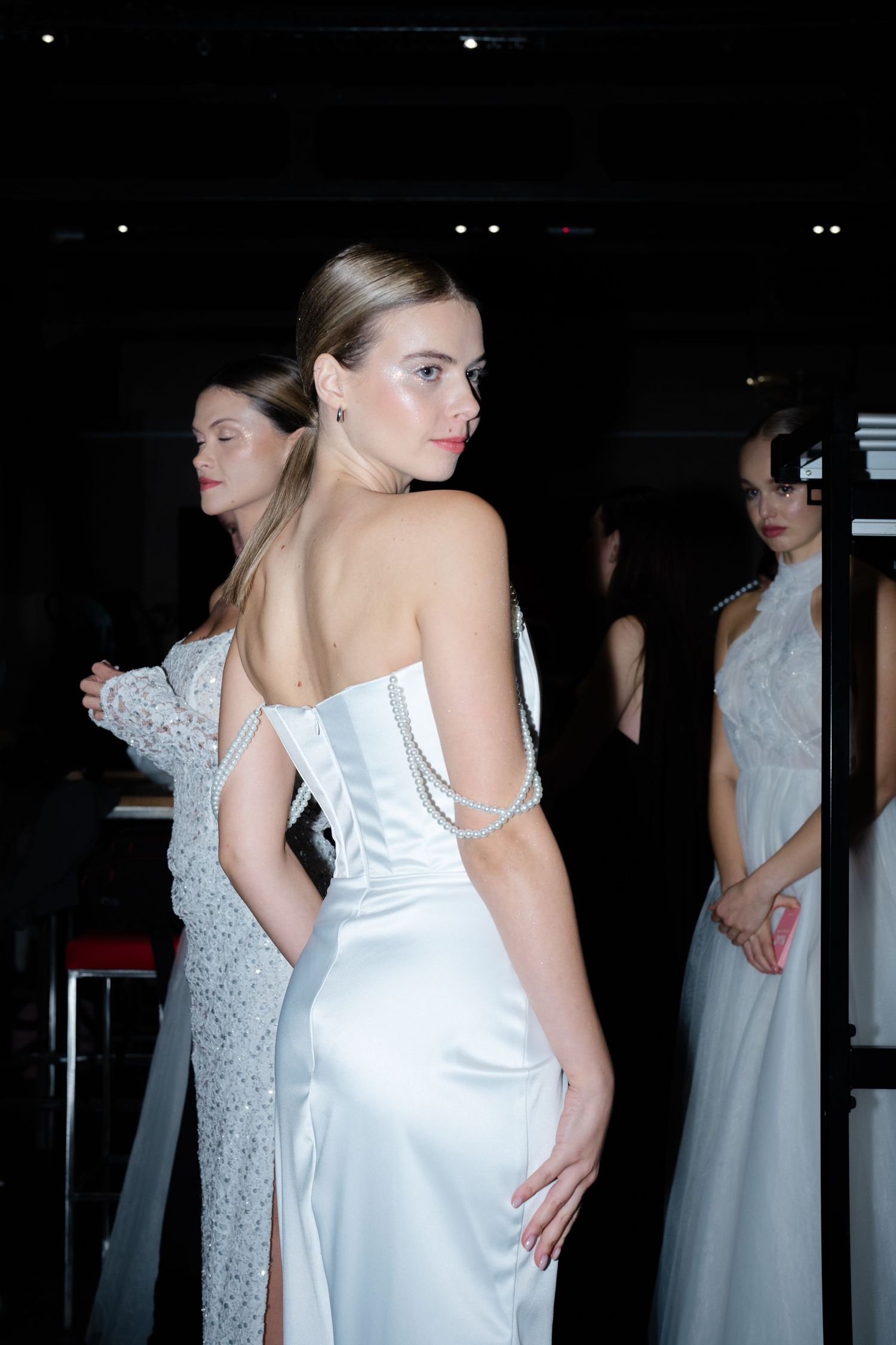 Backstage at Budapest Bridal Fashion Show 2024 featuring bridal couture and models preparing for a stunning runway presentation