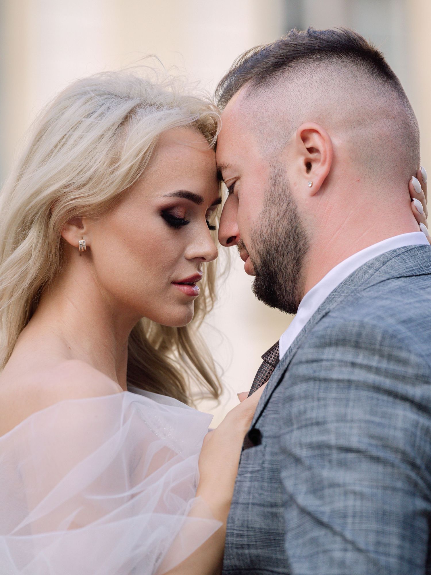Dynamic couple posing at Prague Castle during a destination elopement, surrounded by historic architecture, captured by Hang Pham