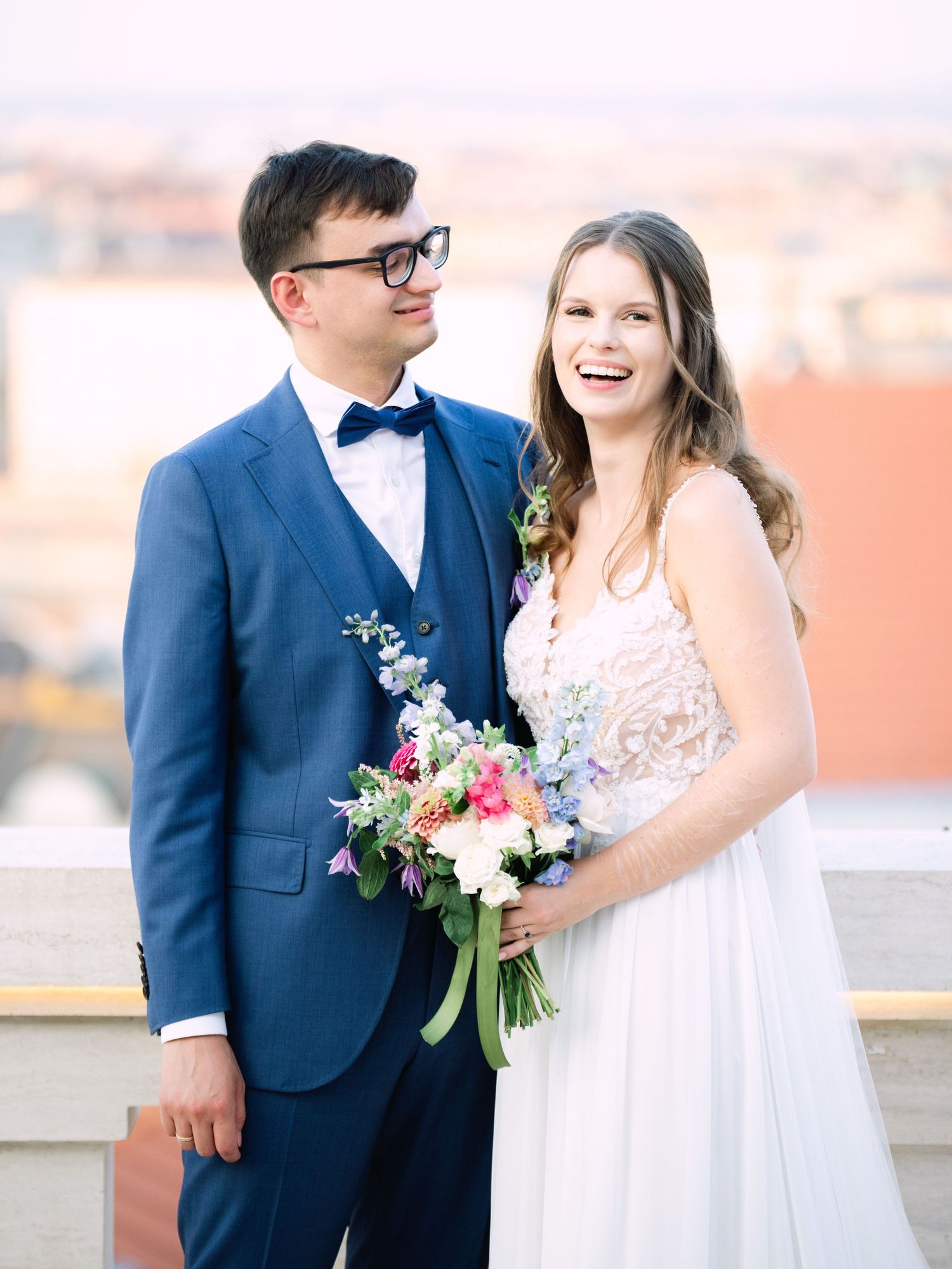 Creative couple' portraits on the Panorama Terrace at Aranybástya Restaurant in Budapest during an intimate destination wedding by Hang Pham