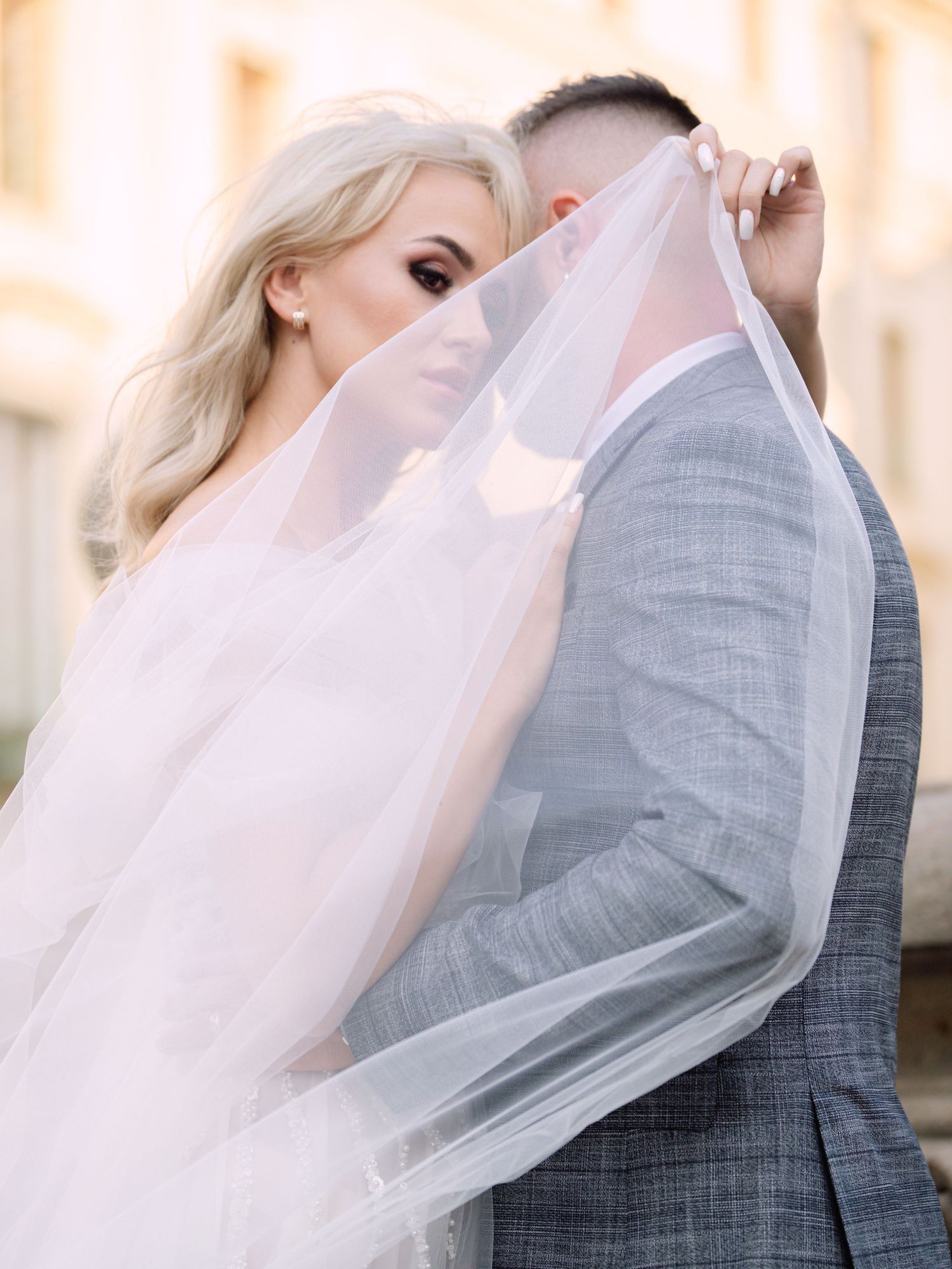 Dynamic couple posing at Prague Castle during a destination elopement, surrounded by historic architecture, captured by Hang Pham