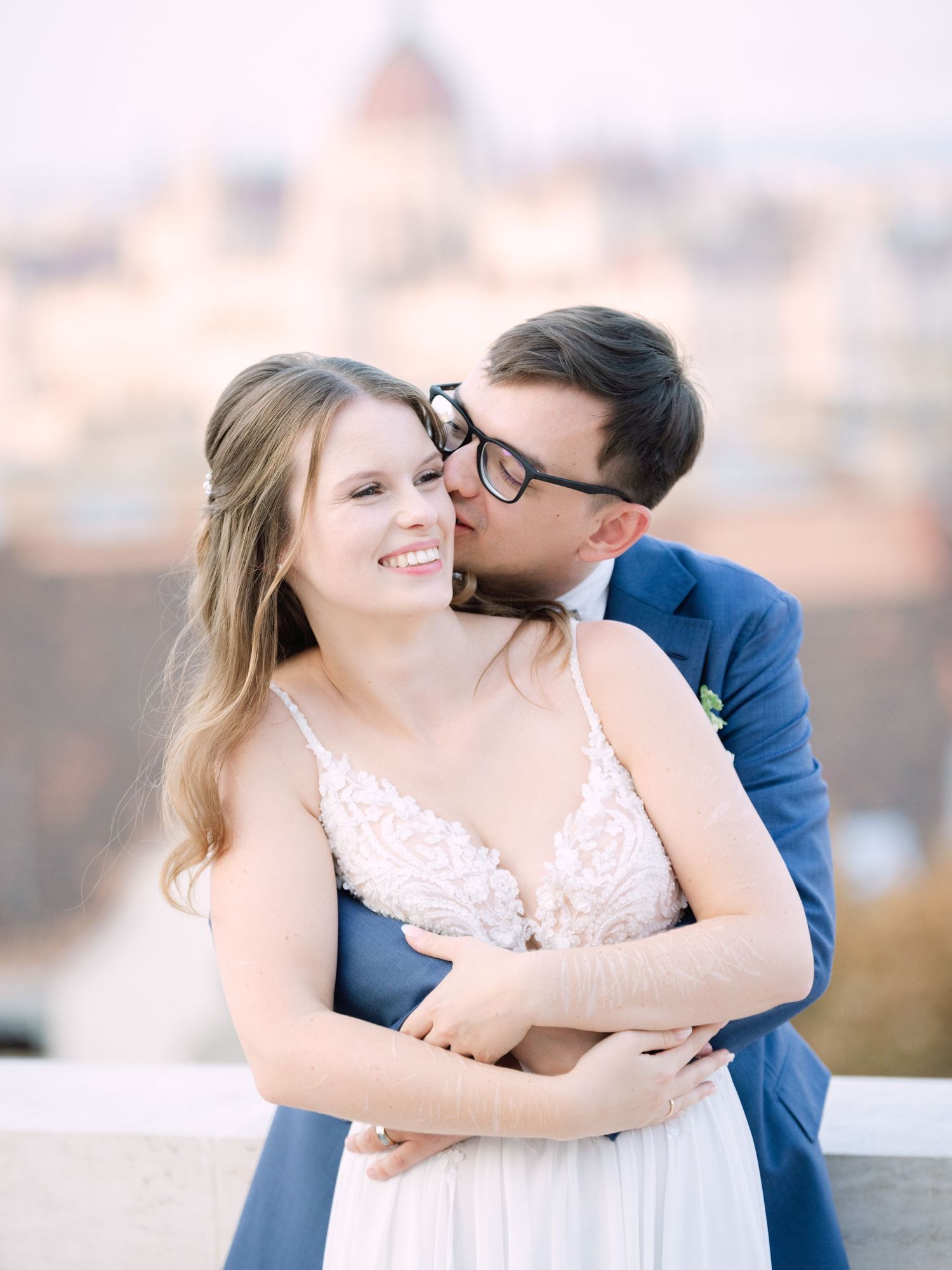 Creative couple' portraits on the Panorama Terrace at Aranybástya Restaurant in Budapest during an intimate destination wedding by Hang Pham