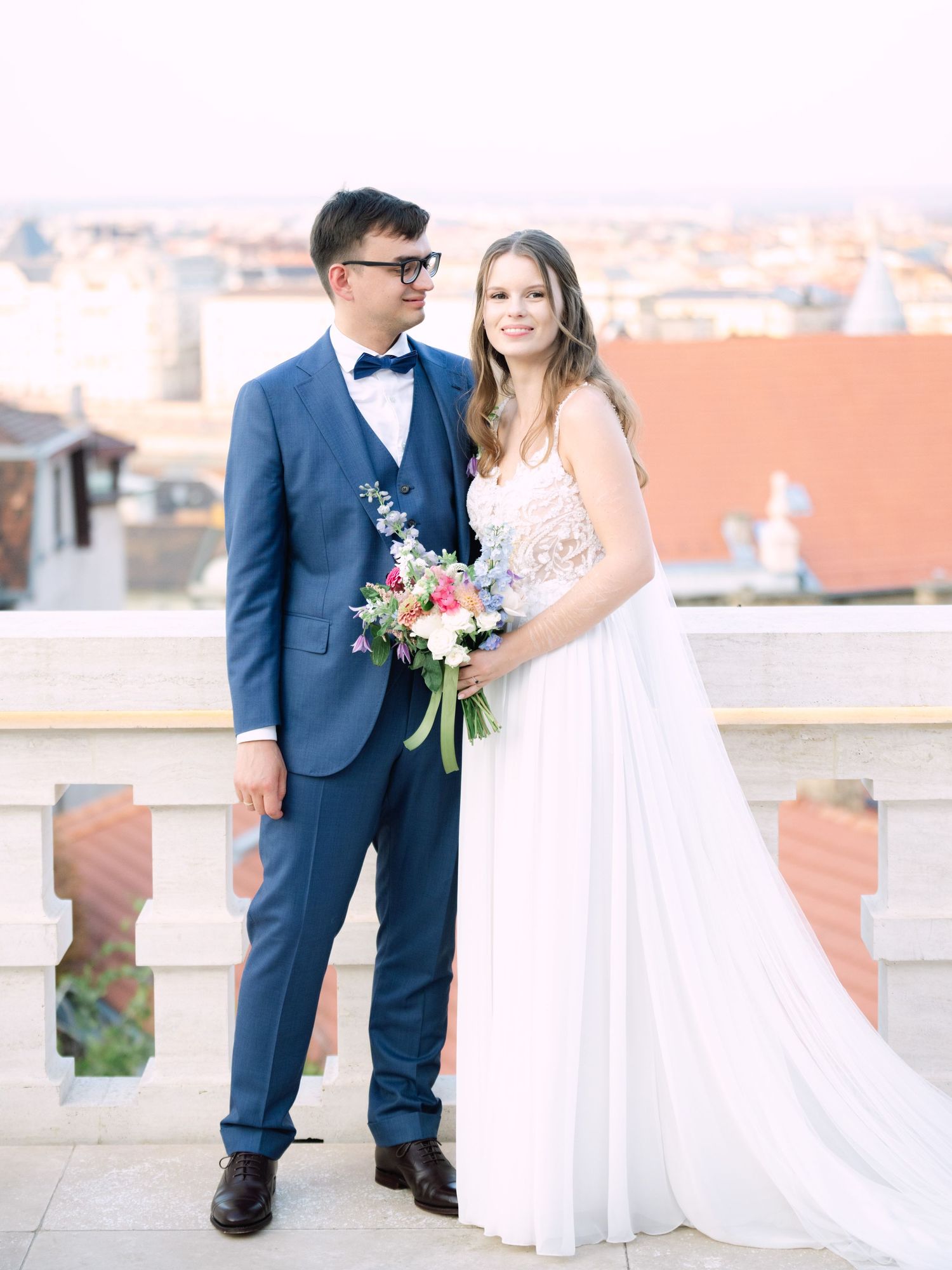 Creative couple' portraits on the Panorama Terrace at Aranybástya Restaurant in Budapest during an intimate destination wedding by Hang Pham