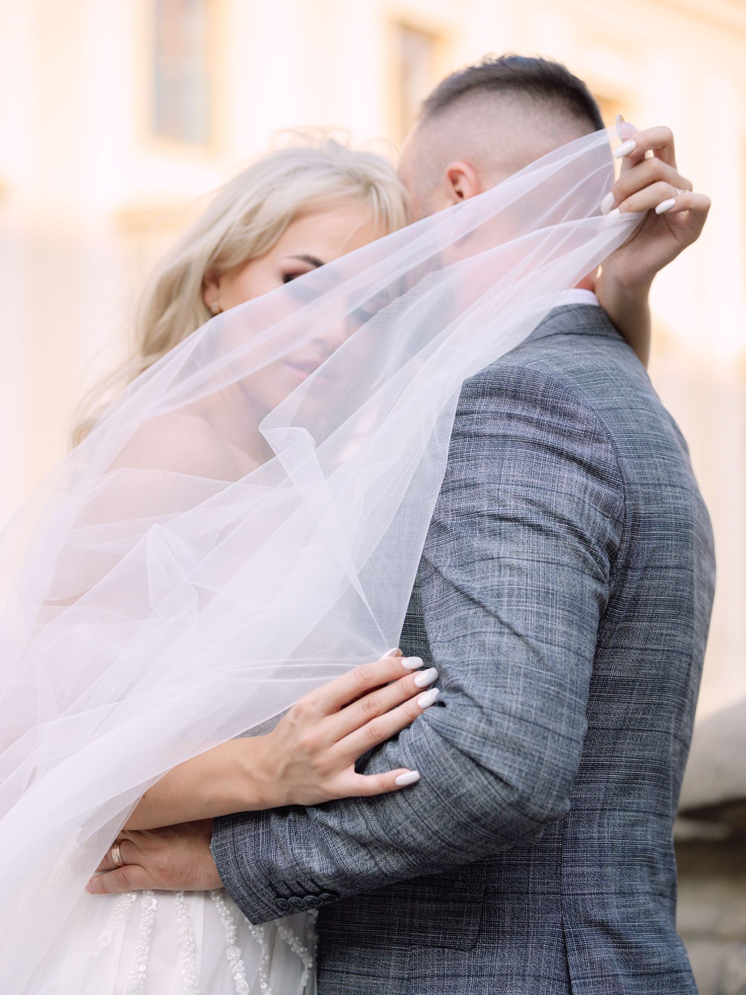 Dynamic couple posing at Prague Castle during a destination elopement, surrounded by historic architecture, captured by Hang Pham