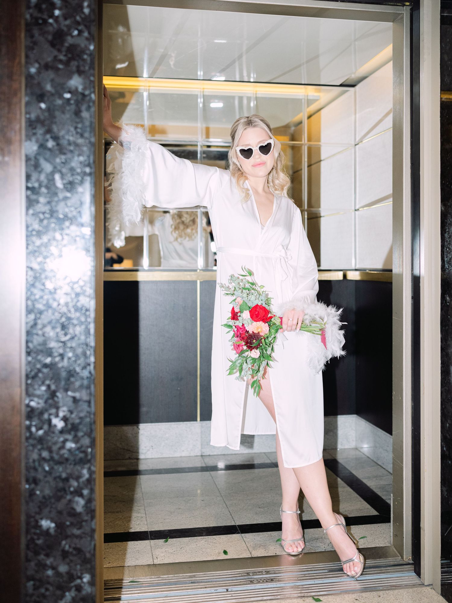 Creative flash shots of a captivating bride in a Hilton Hotel suite in Budapest, styled for an intimate luxury destination wedding
