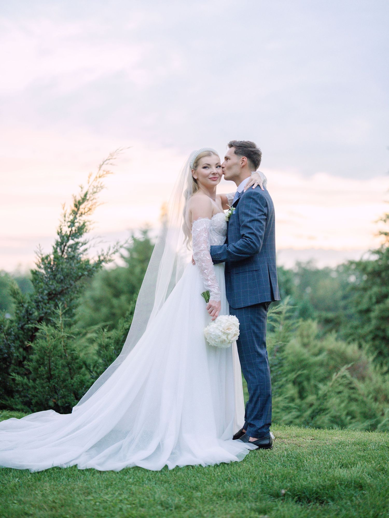 Captivating couple posing in Napkor during golden hour sunset for a wedding creative session, beautifully captured by Hang Pham Photography