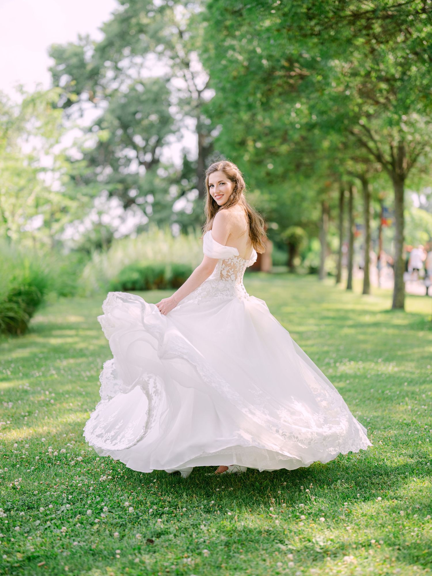 Cheerful bride posing at Kopaszi Gat in Budapest during a romantic pre-wedding session, beautifully captured in natural light by Hang Pham