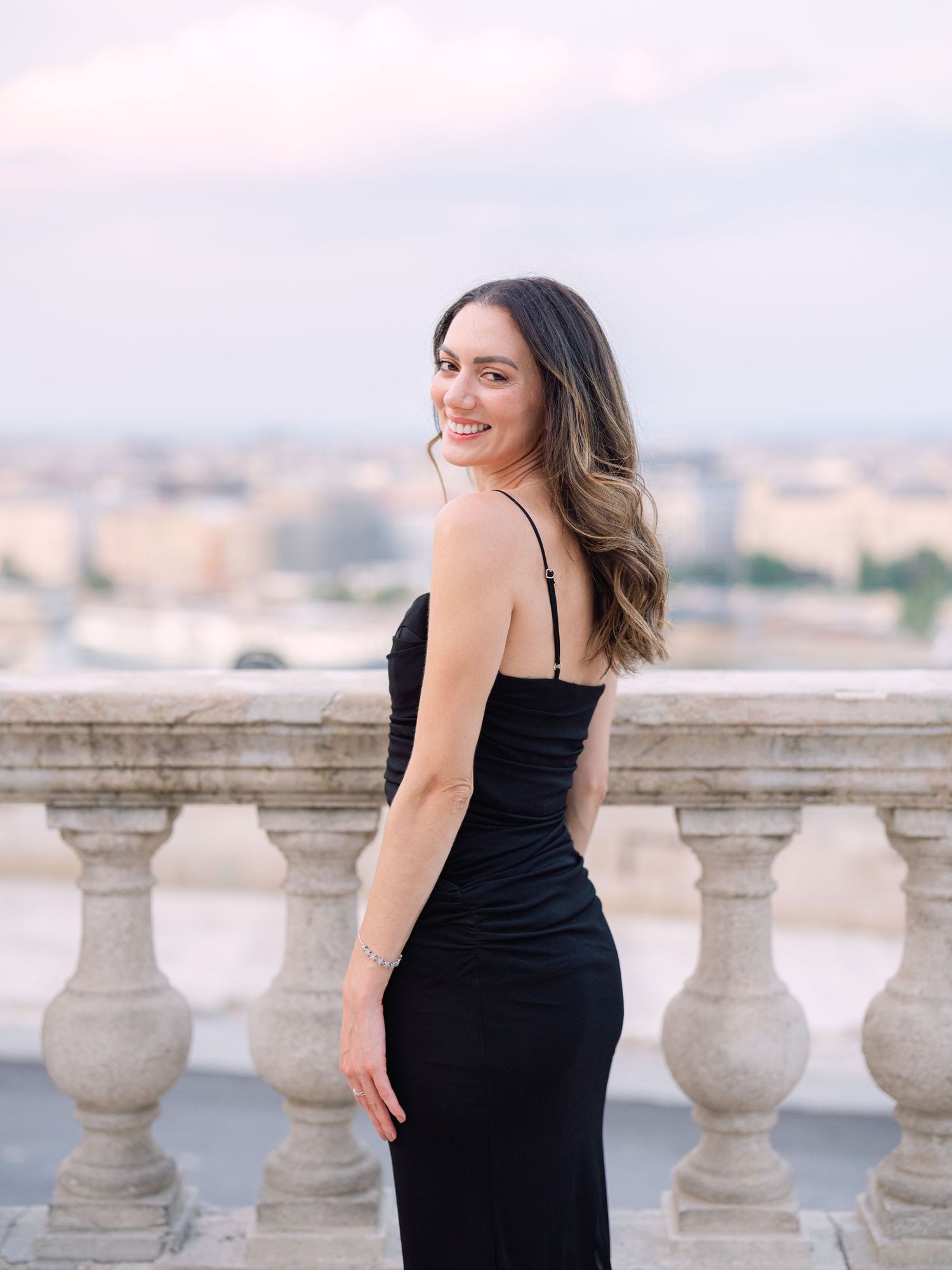 Elegant female posing around Buda Castle in Budapest during a chic portrait session, beautifully captured by Hang Pham Photography