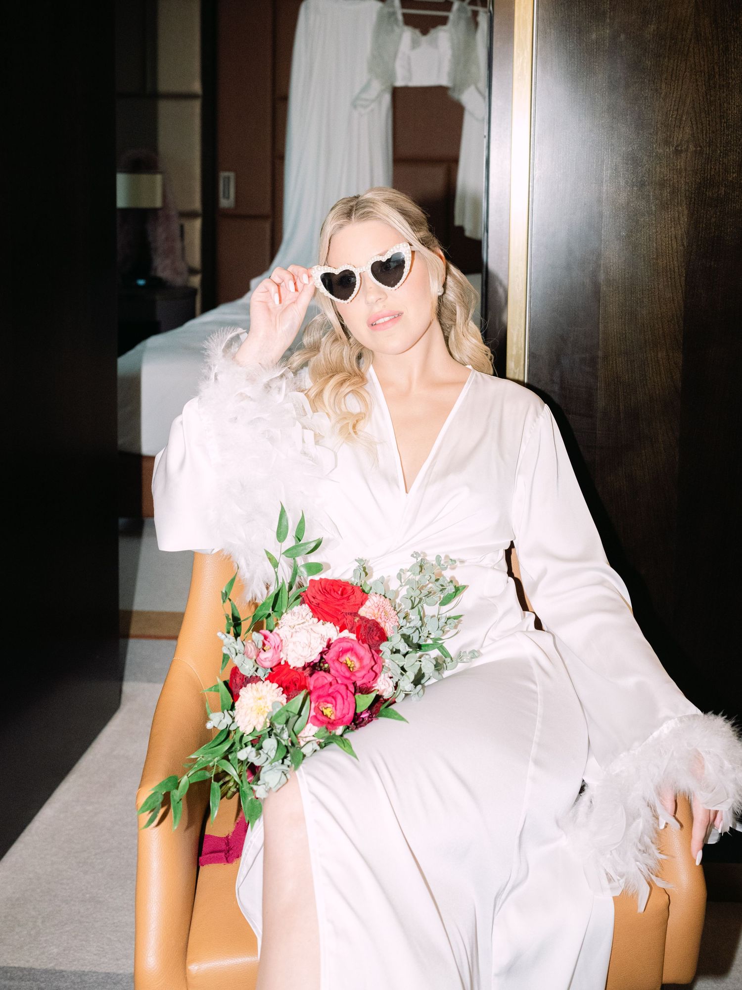 Creative flash shots of a captivating bride in a Hilton Hotel suite in Budapest, styled for an intimate luxury destination wedding