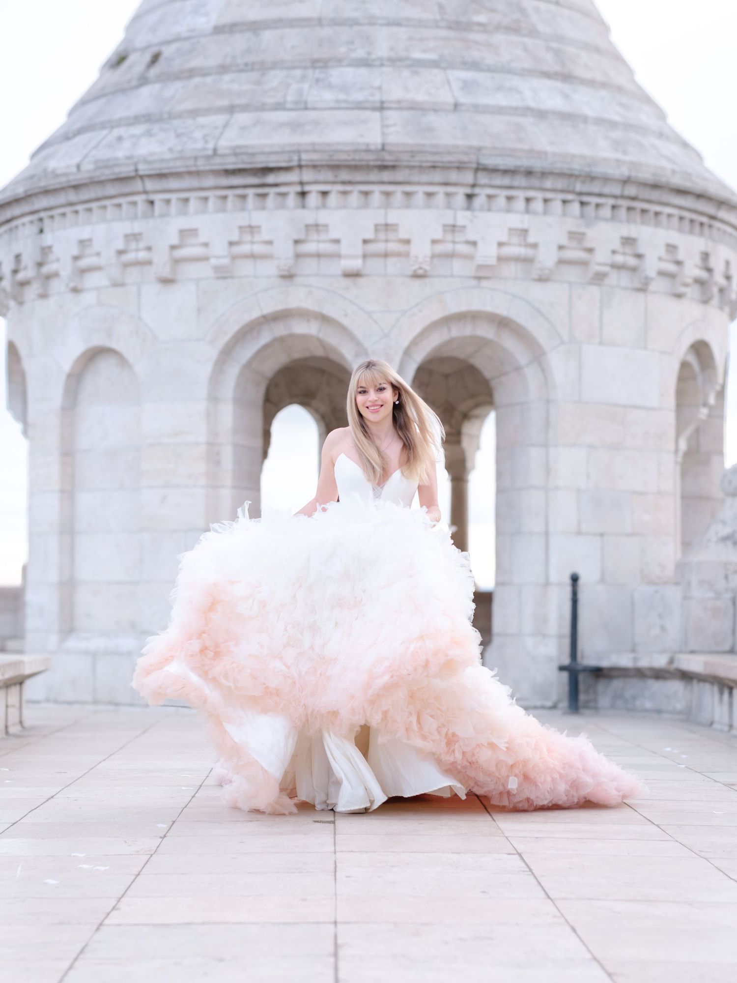 Graceful bride in Eva Halasz couture posing at Fisherman’s Bastion during a romantic elopement shoot, captured by Hang Pham Photography