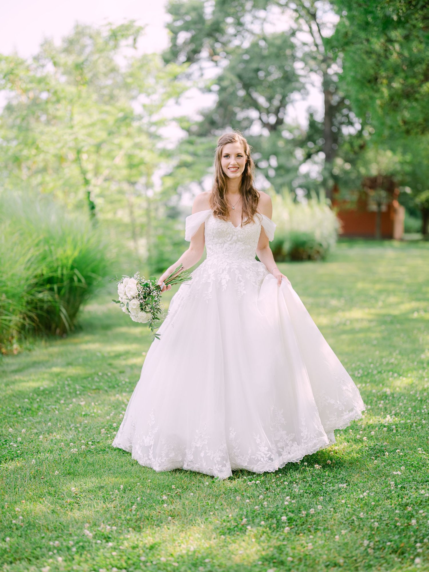 Cheerful bride posing at Kopaszi Gat in Budapest during a romantic pre-wedding session, beautifully captured in natural light by Hang Pham