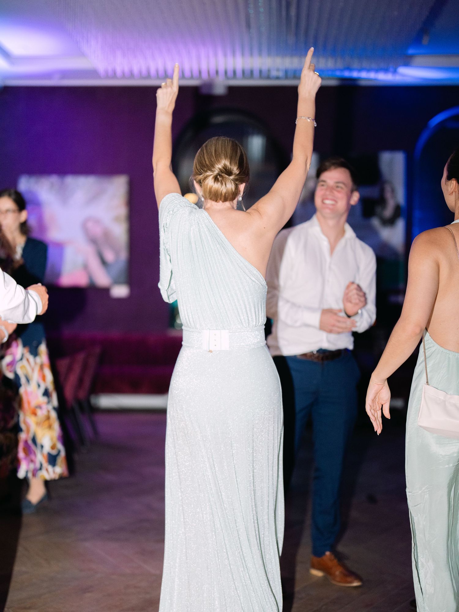 Vibrant party scene at an intimate destination wedding hosted at Aranybástya Restaurant in Budapest, capturing joyful celebration moments