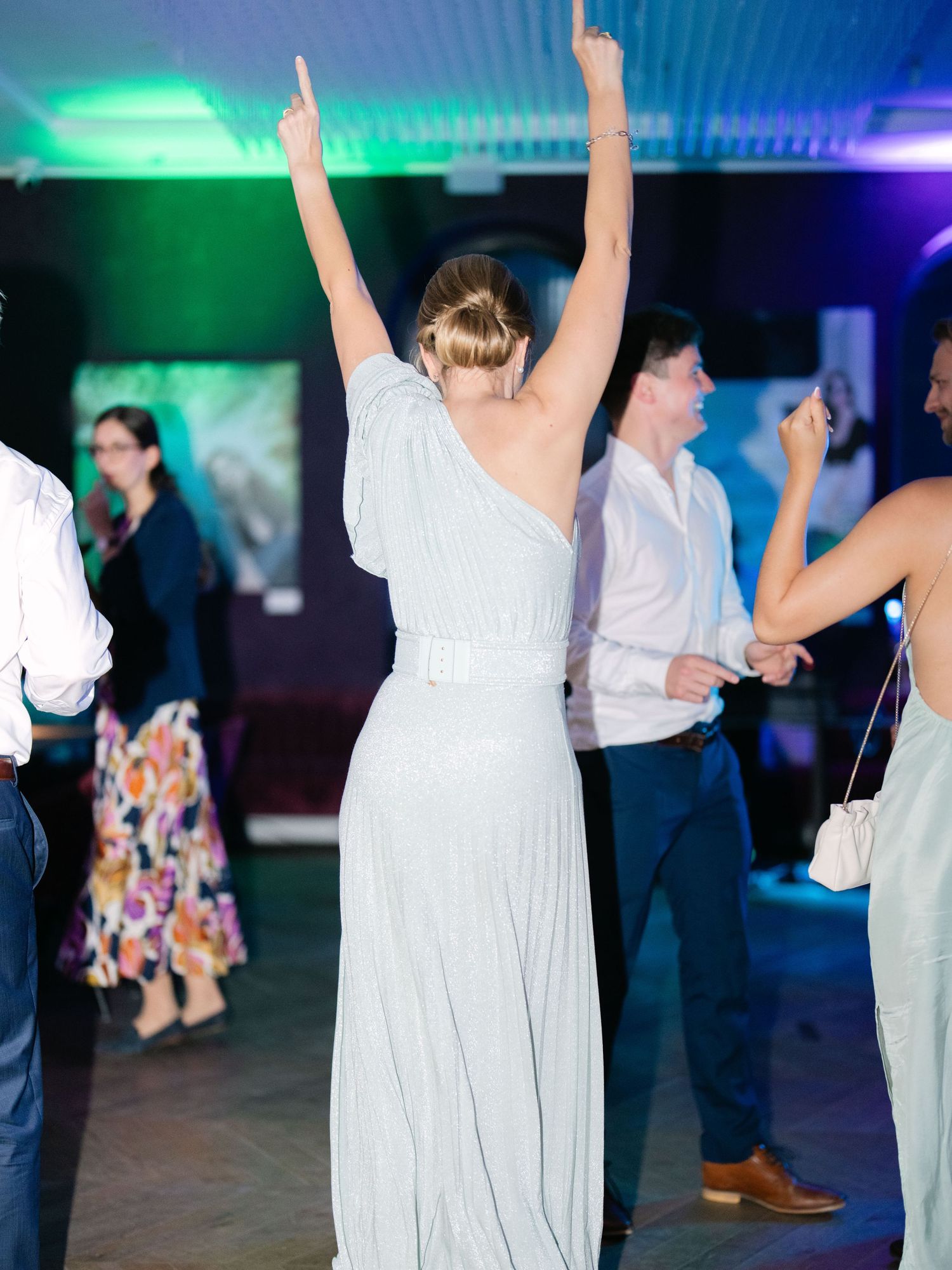 Vibrant party scene at an intimate destination wedding hosted at Aranybástya Restaurant in Budapest, capturing joyful celebration moments