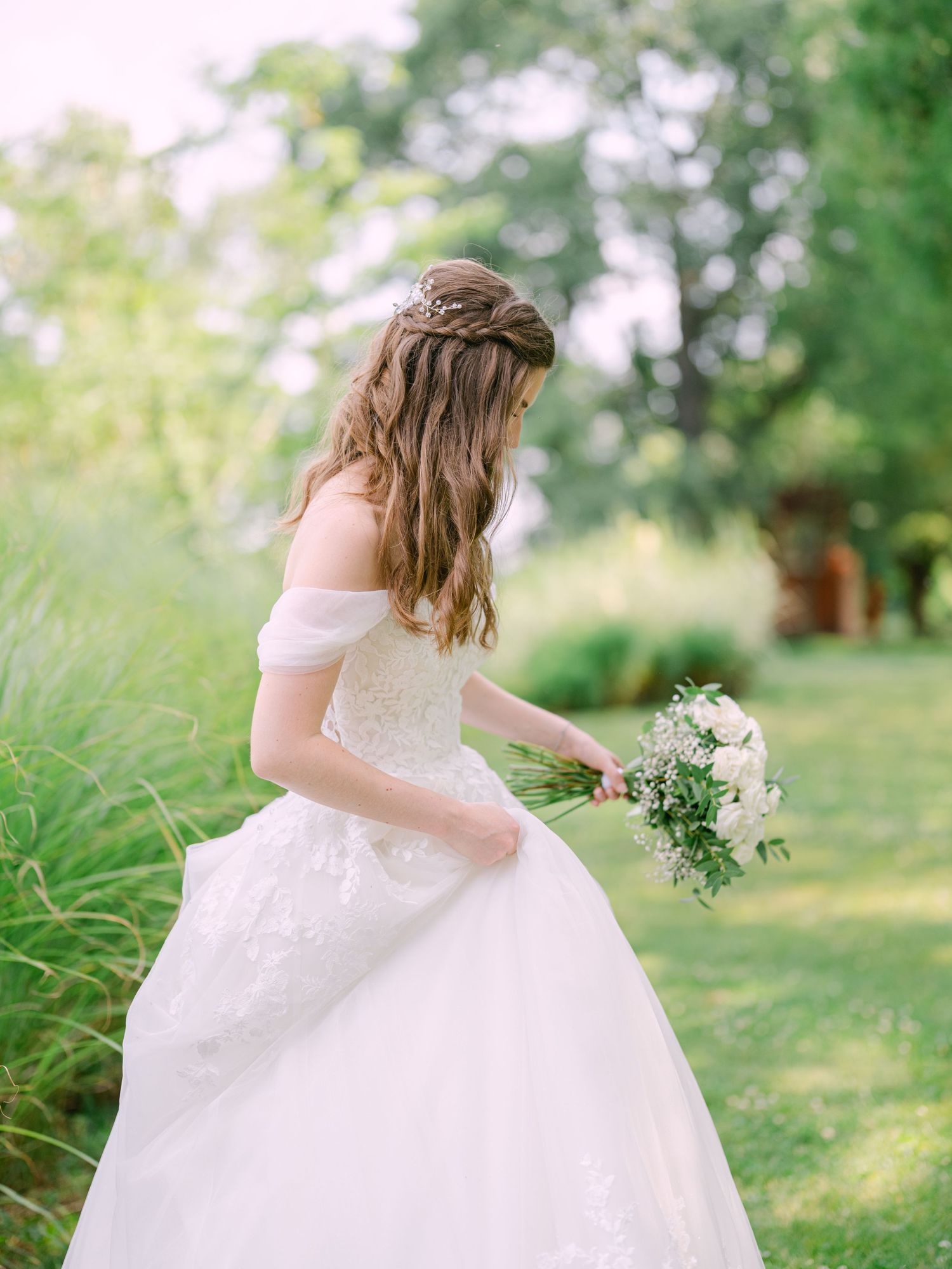 Cheerful bride posing at Kopaszi Gat in Budapest during a romantic pre-wedding session, beautifully captured in natural light by Hang Pham