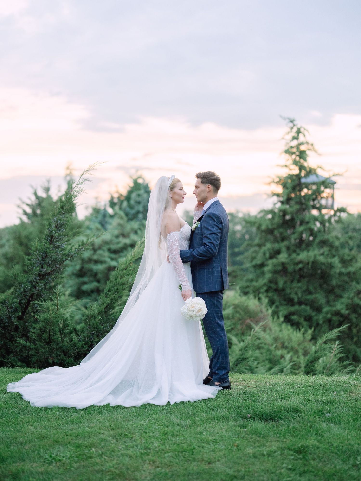 Captivating couple posing in Napkor during golden hour sunset for a wedding creative session, beautifully captured by Hang Pham Photography