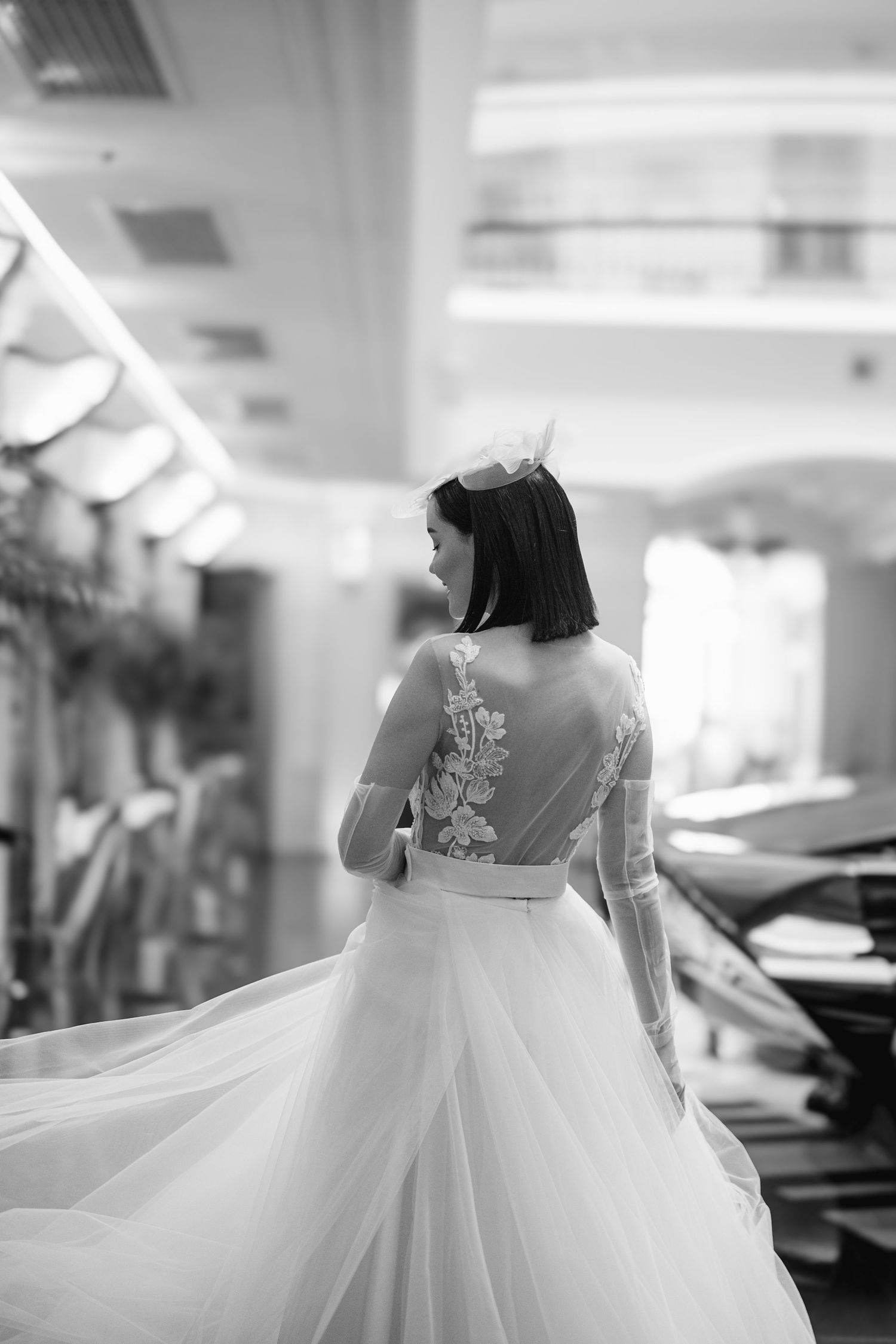Elegant bride in a Nagy Agota wedding dress posing at Aria Hotel Budapest during a destination wedding, captured by Hang Pham Photography