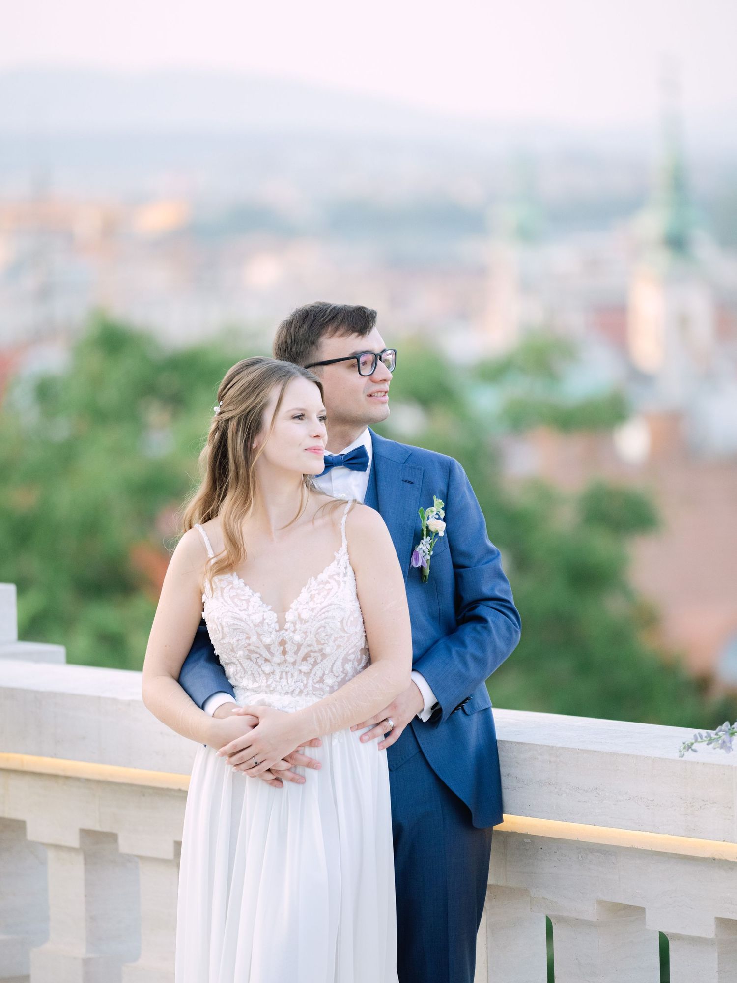 Creative couple' portraits on the Panorama Terrace at Aranybástya Restaurant in Budapest during an intimate destination wedding by Hang Pham